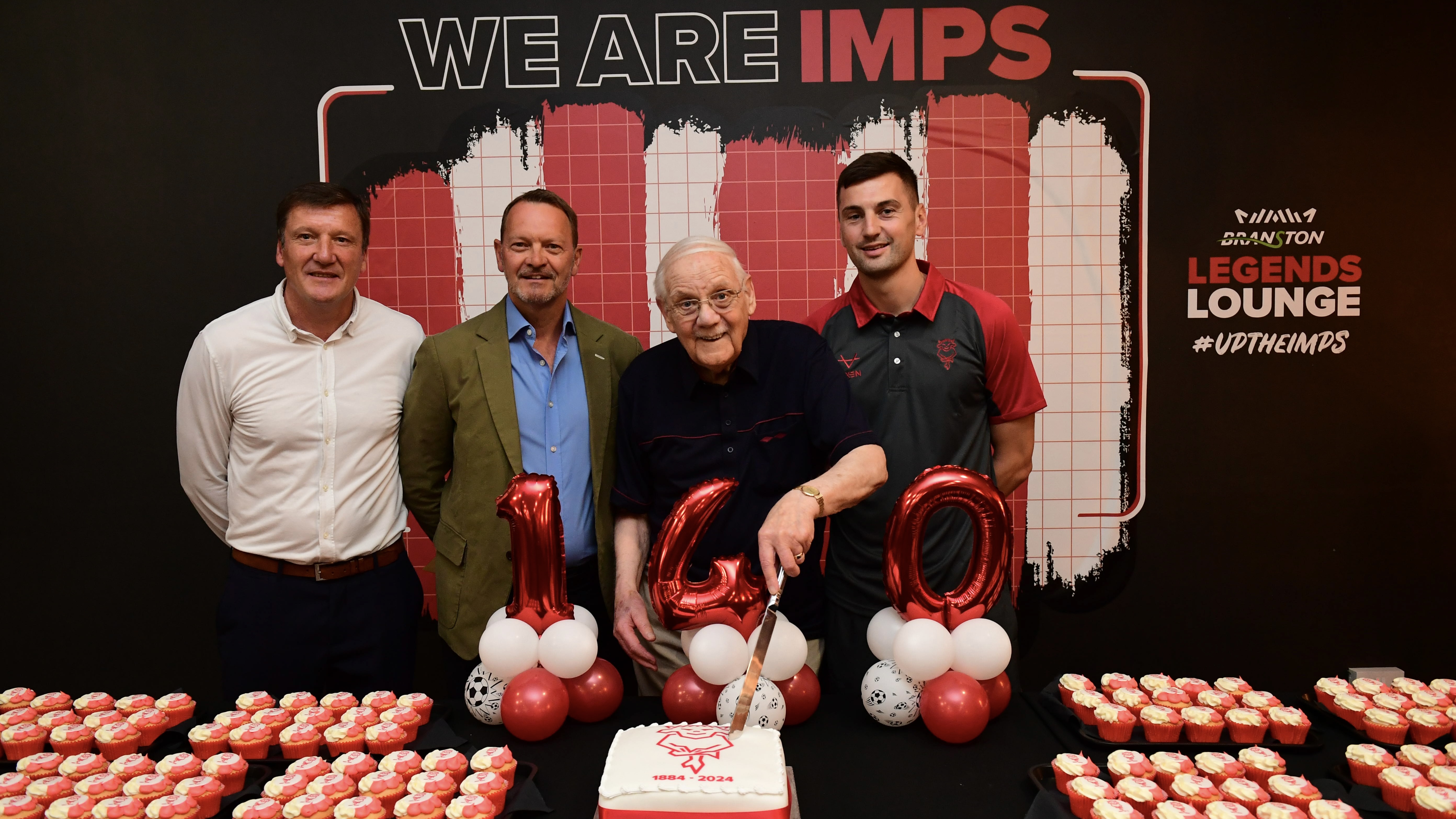 Cutting the cake at the 140th birthday
