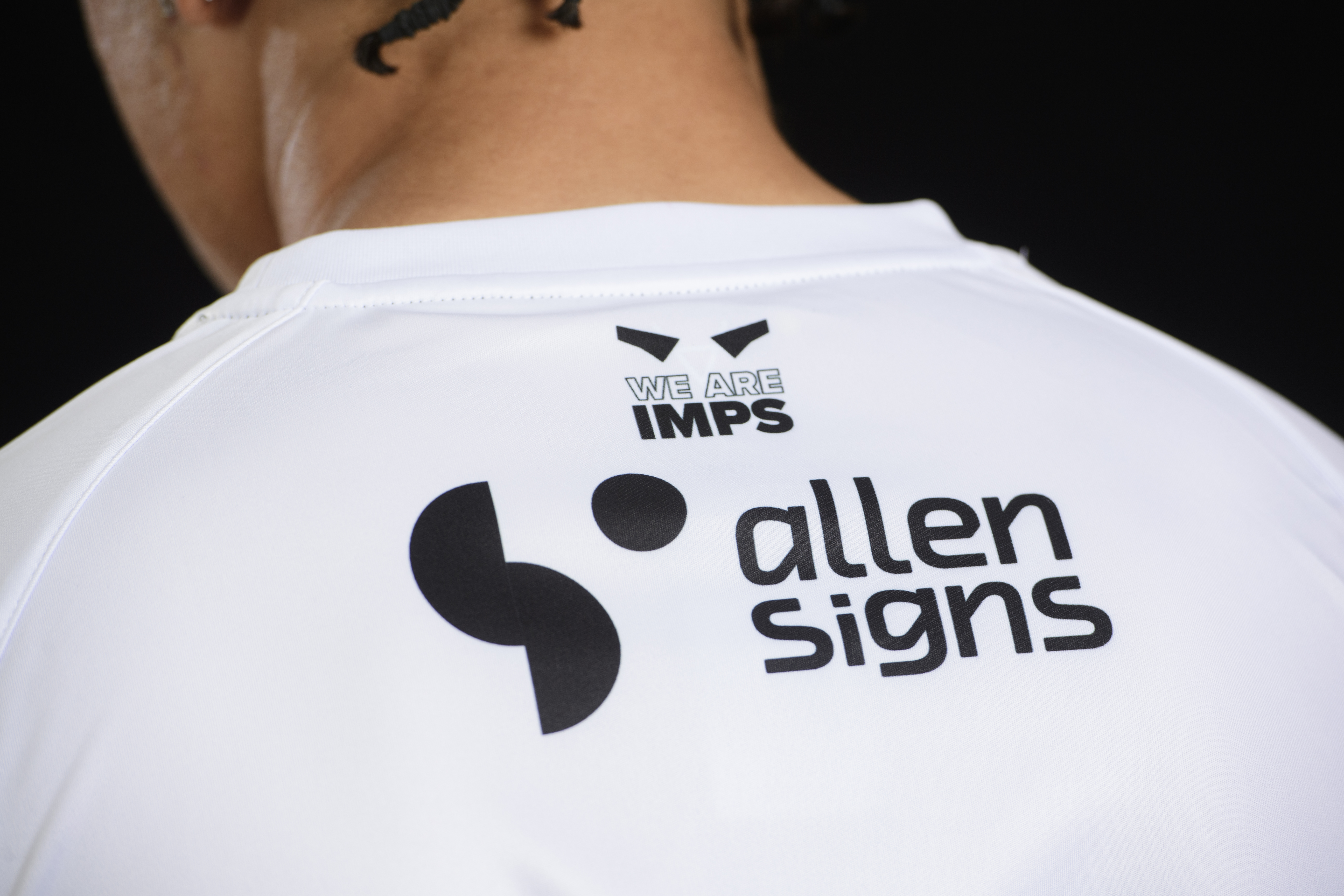 A close up of the back of the 24/25 away shirt design focused on the We Are Imps design and Allen Signs logo.