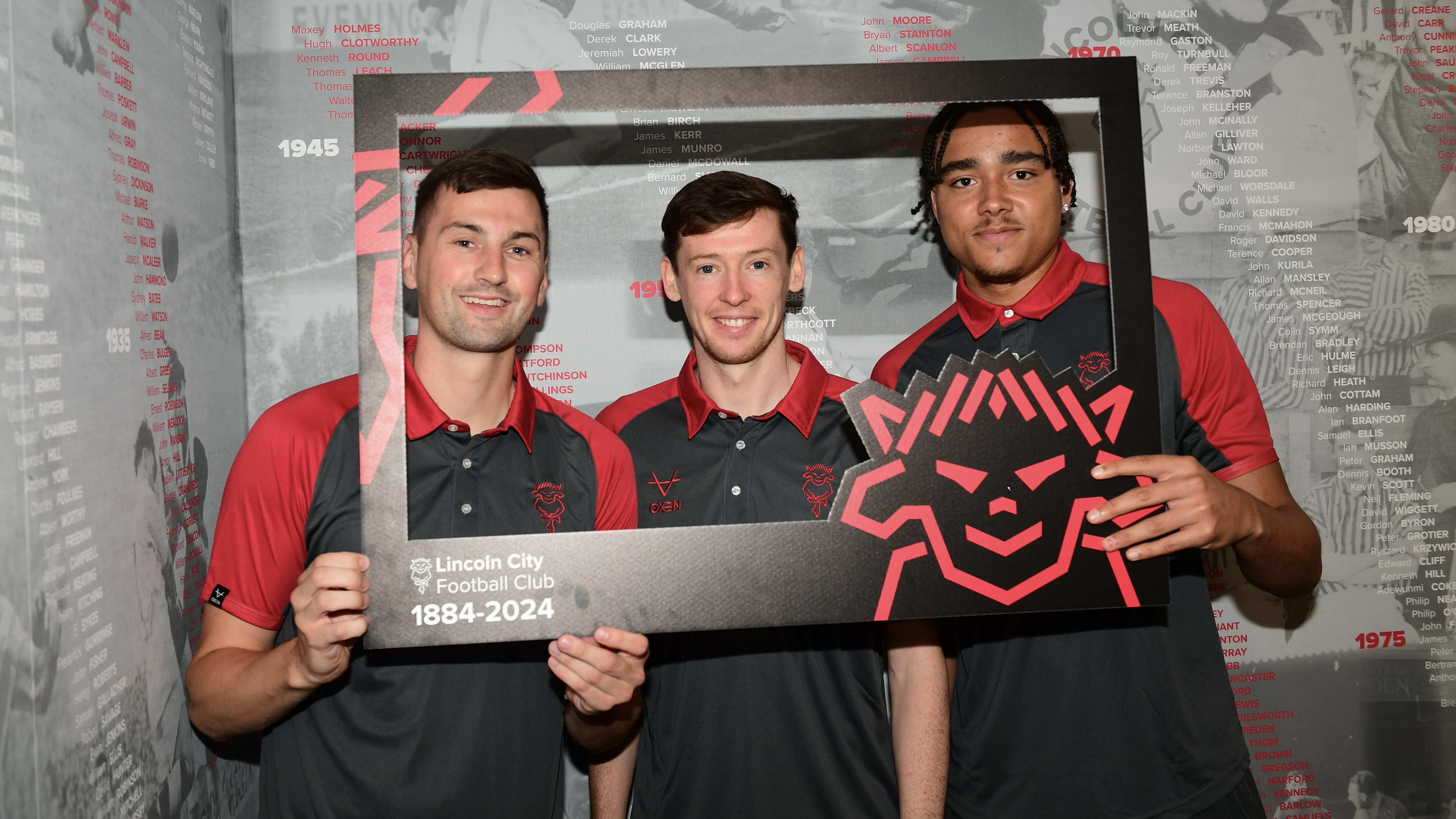 Paudie O'Connor, Conor McGrandles and Jovon Makama posing for a picture at the Imps' 140th birthday.