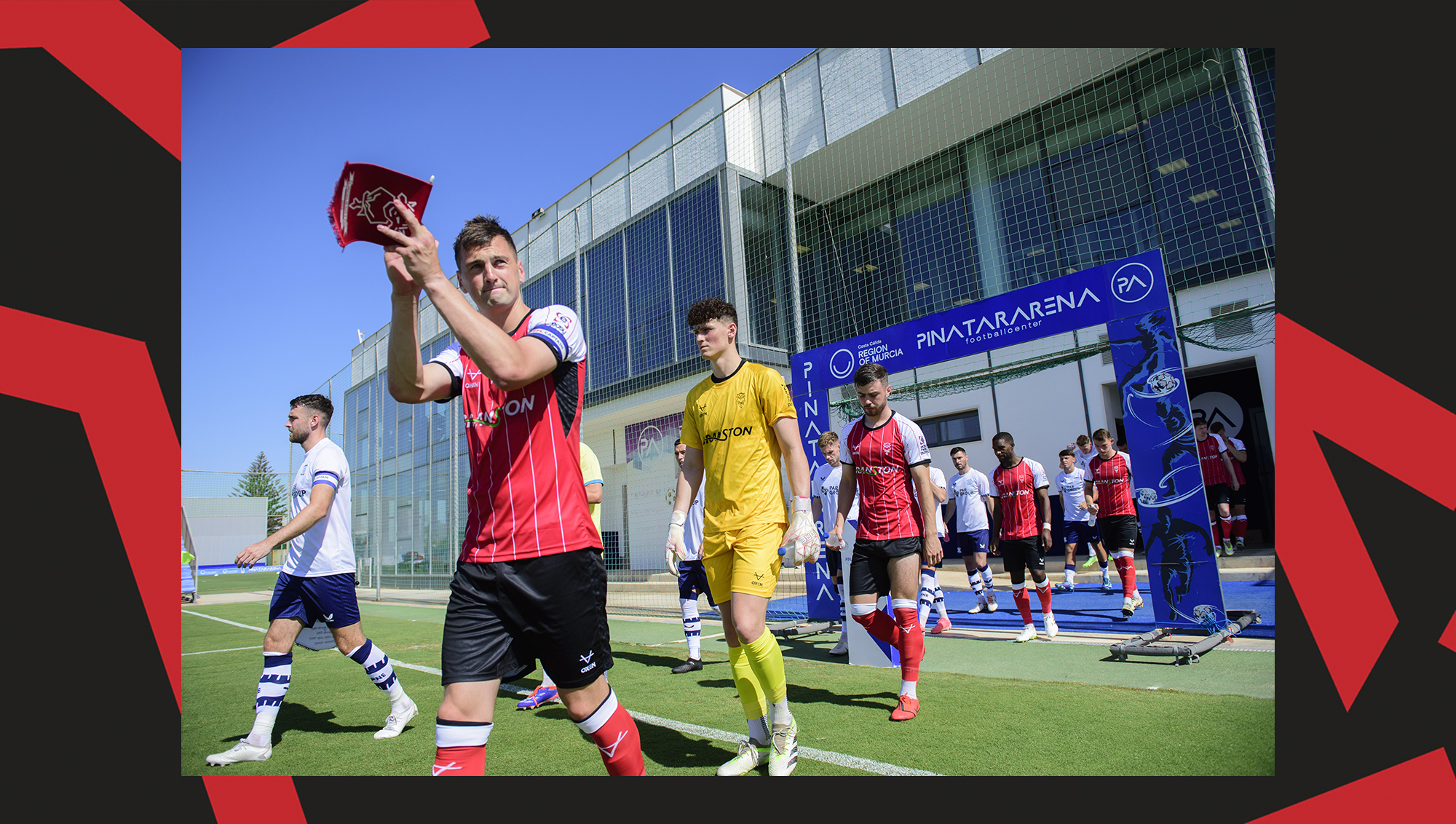 Paudie O'Connor walks out with the Lincoln City players