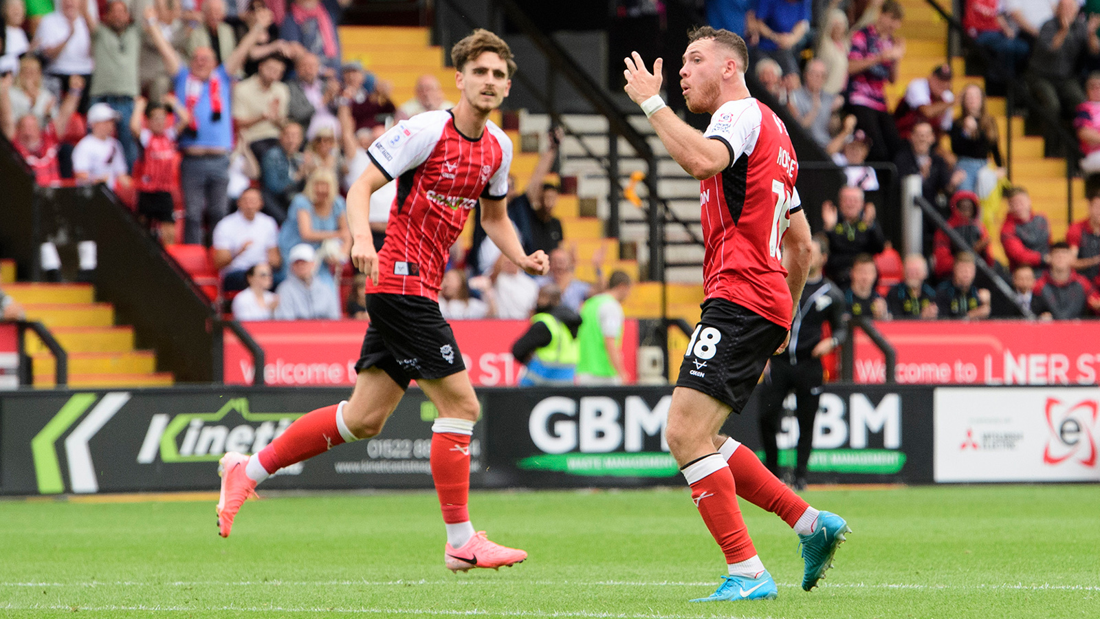 Ben House celebrates after scoring for Lincoln against Barnsley