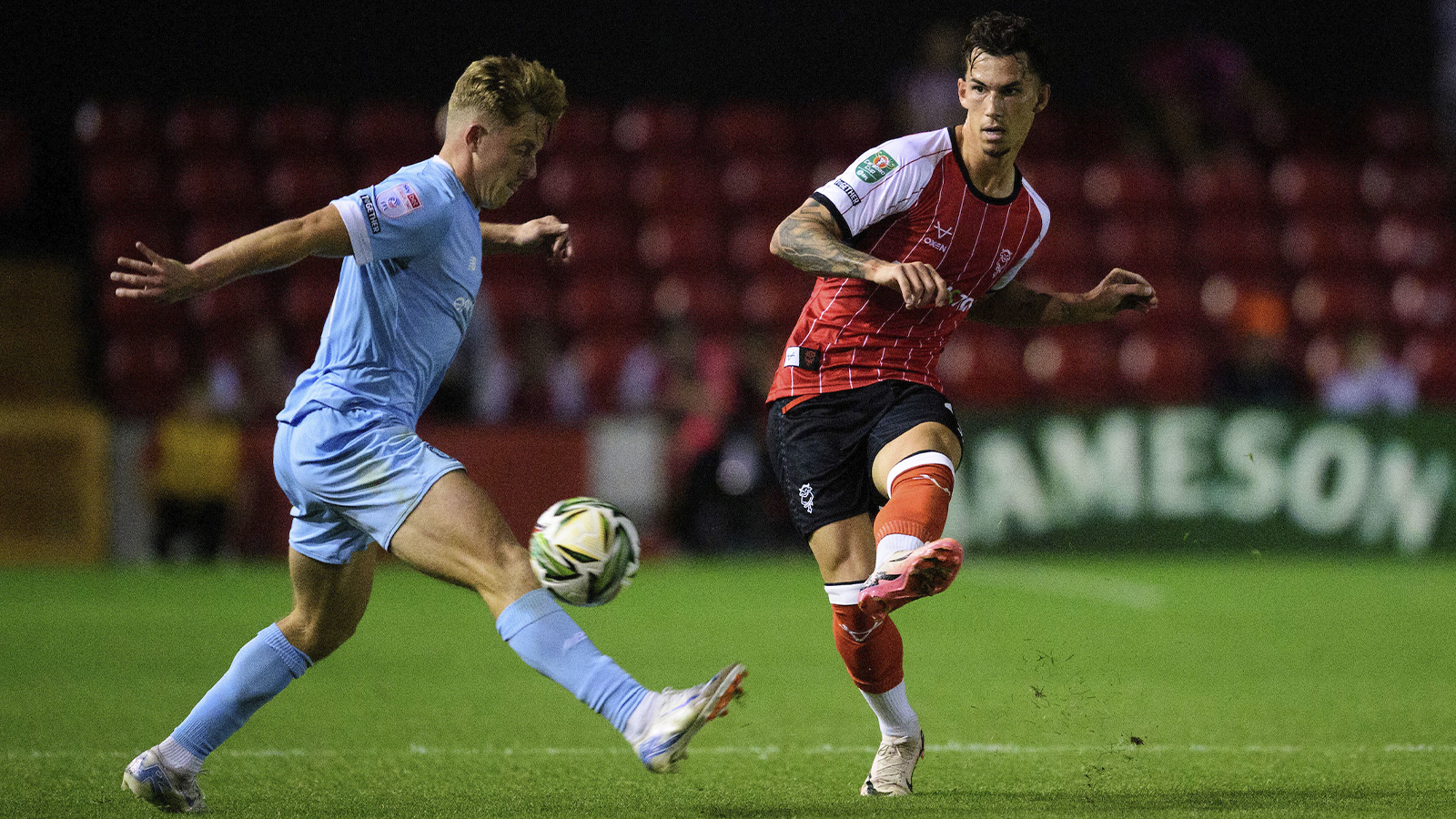 Lewis Montsma plays a pass in City's home Carabao Cup first round game against Harrogate Town