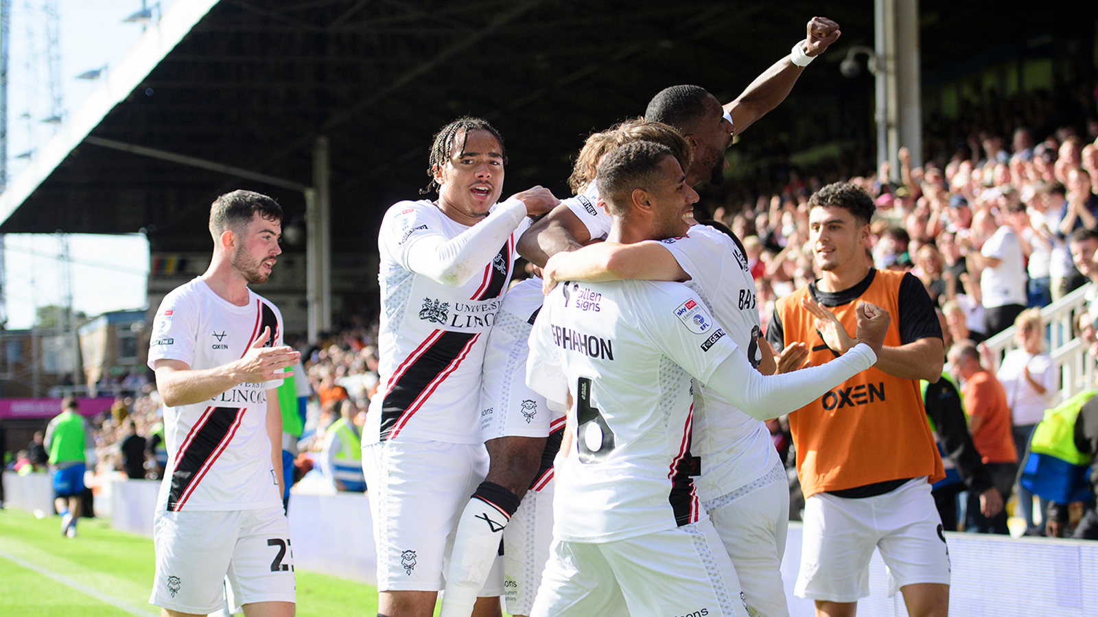 City celebrate scoring at Peterborough United