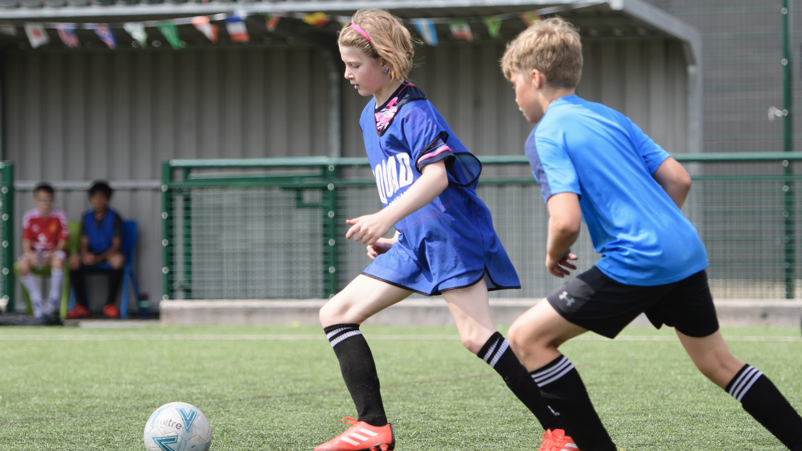 Girl playing on the 3G pitch.