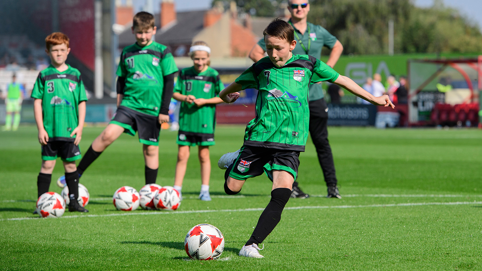 Young fans enjoying a matchday experience at Lincoln City's home game against Wigan Athletic.