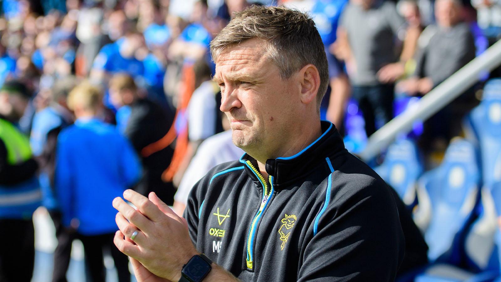 Michael Skubala applauds during City's 1-1 draw at Peterborough United