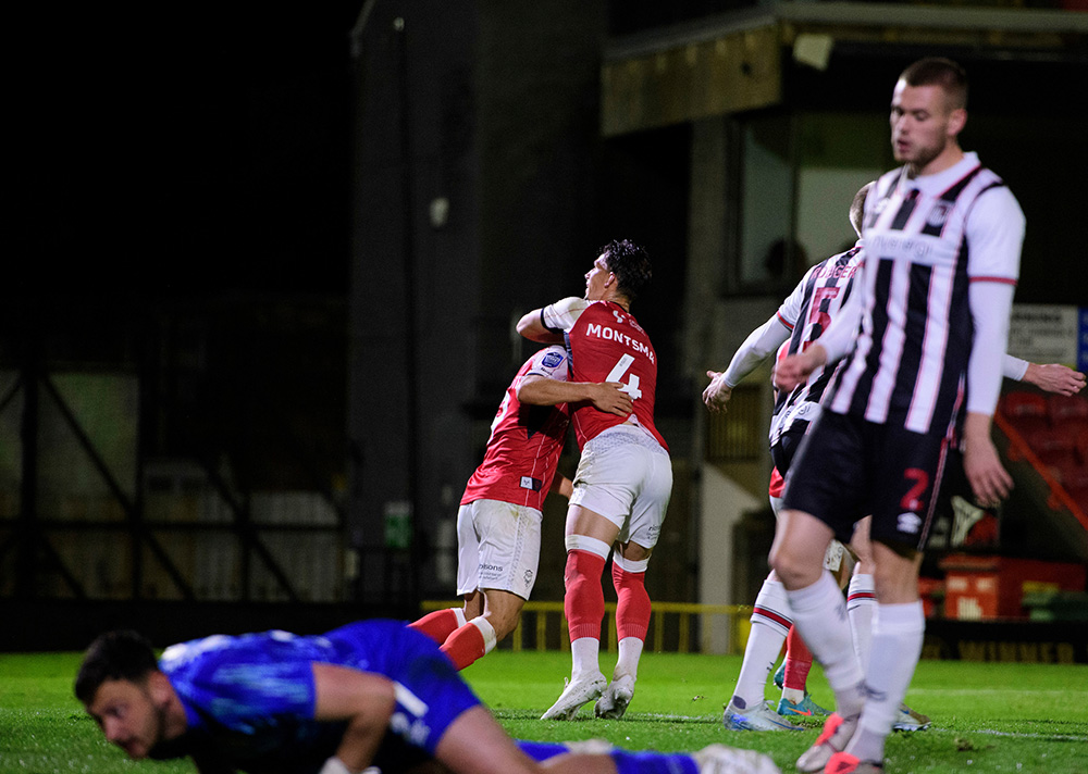 Bailey Cadamarteri is congratulated by Lewis Montsma after scoring at Grimsby