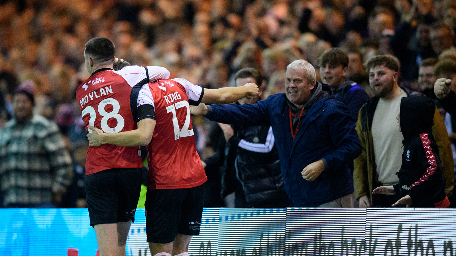 Jack Moylan and Erik Ring celebrate City's late winner against Northampton Town