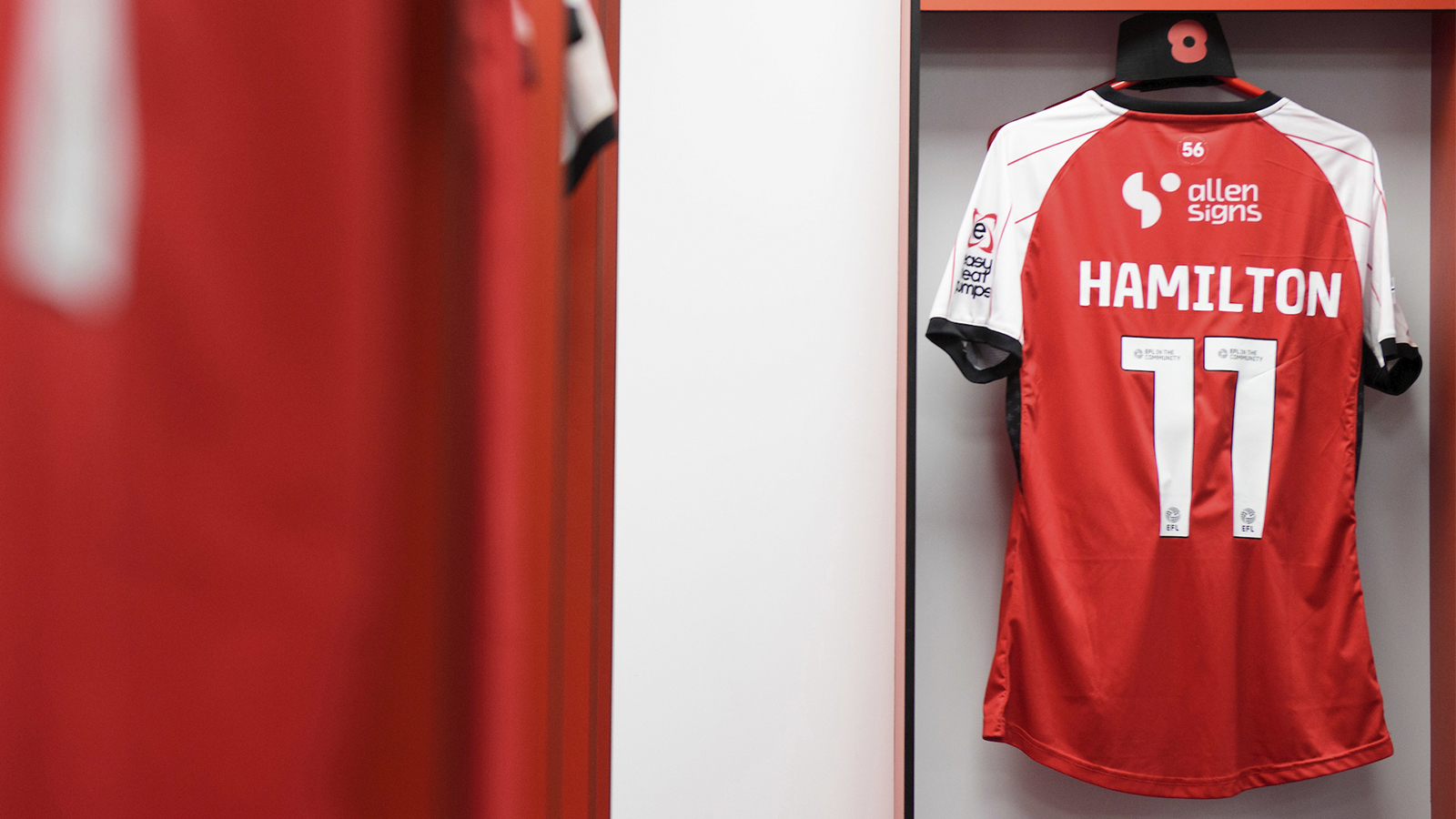 Ethan Hamilton's shirt hung up in the Lincoln City changing room