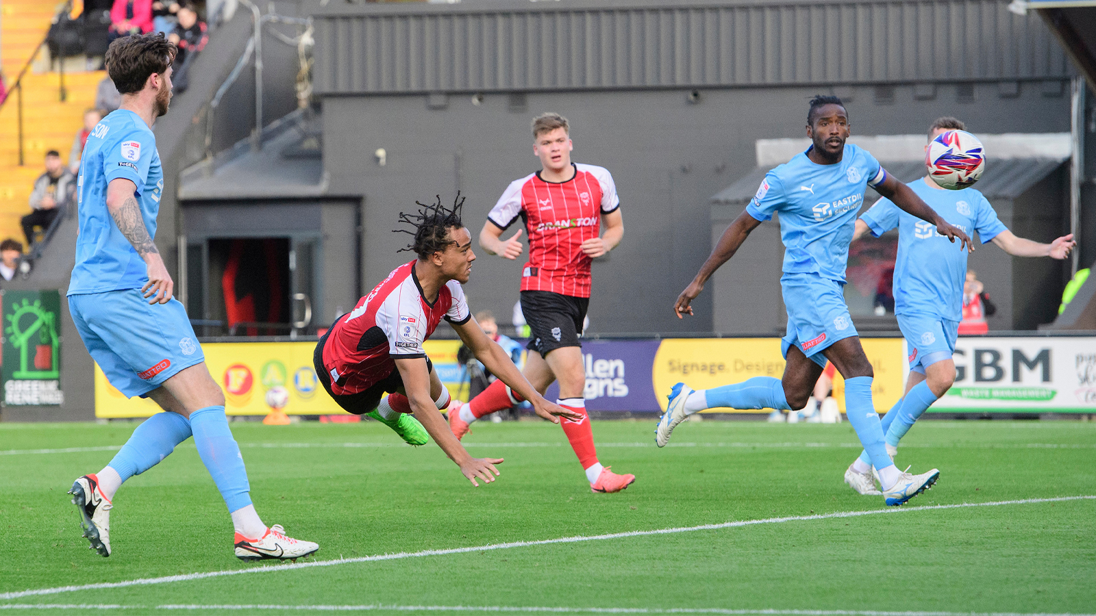 Jovon Makama heads home the opener for Lincoln versus Leyton Orient