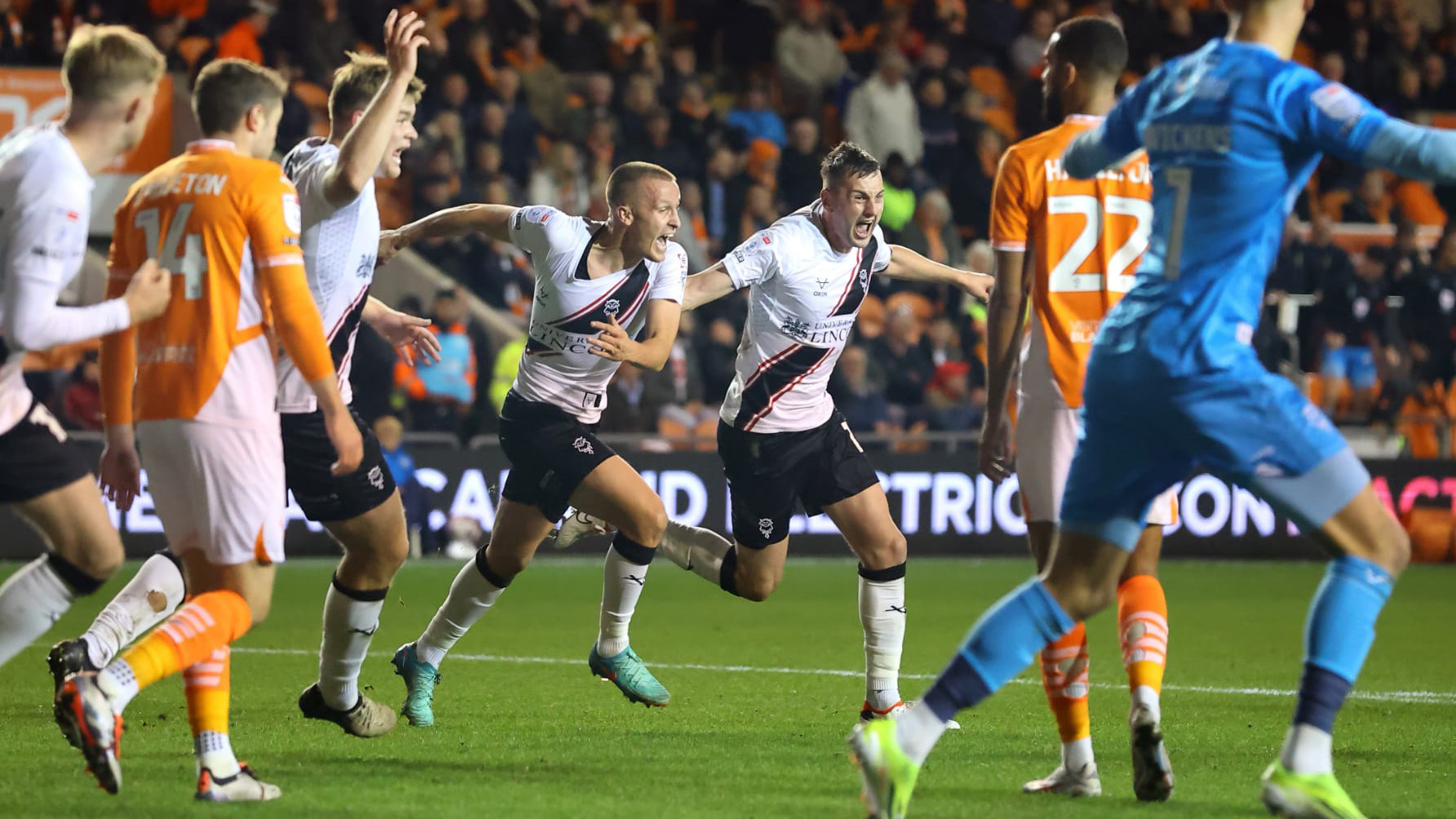 Tom Hamer and Paudie O'Connor celebrate after Lincoln City equalise against Blackpool