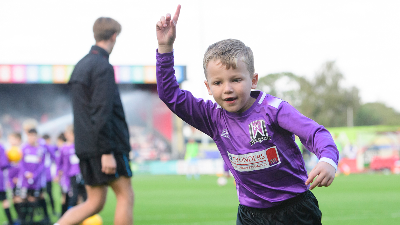 A young player from Welton Bomber Under-8s celebrates scoring at the LNER Stadium