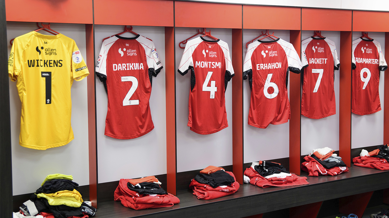 Shirts hung up in the Lincoln City changing room.