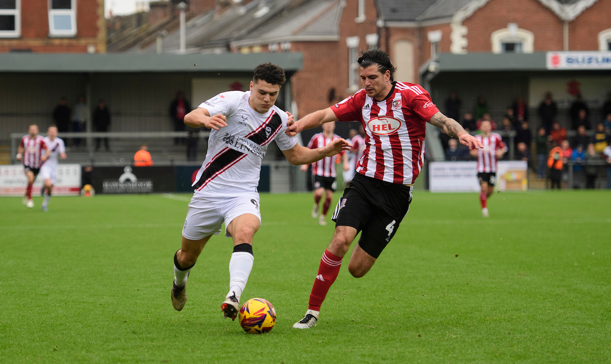 Bailey Cadamarteri drives the Imps forward at Exeter City