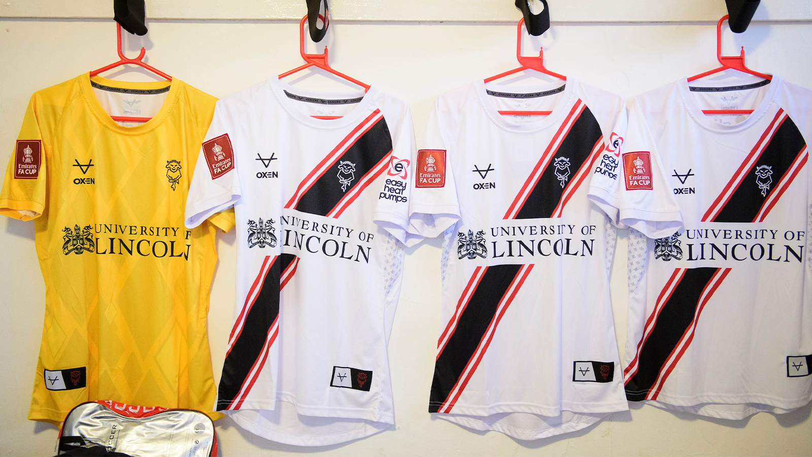 Four away shirts hung up in the Chesham United changing room