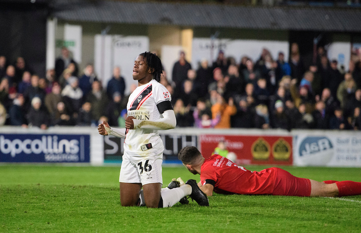 Zane Okoro celebrates City's fourth goal at Chesham