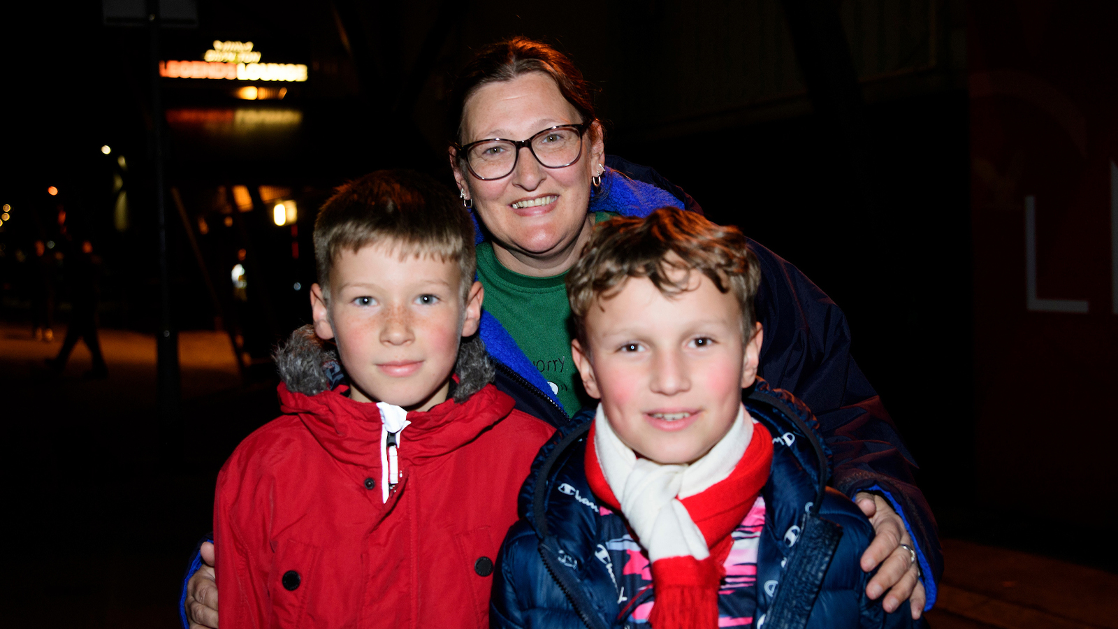 A group of Lincoln City fans outside the stadium at a night game