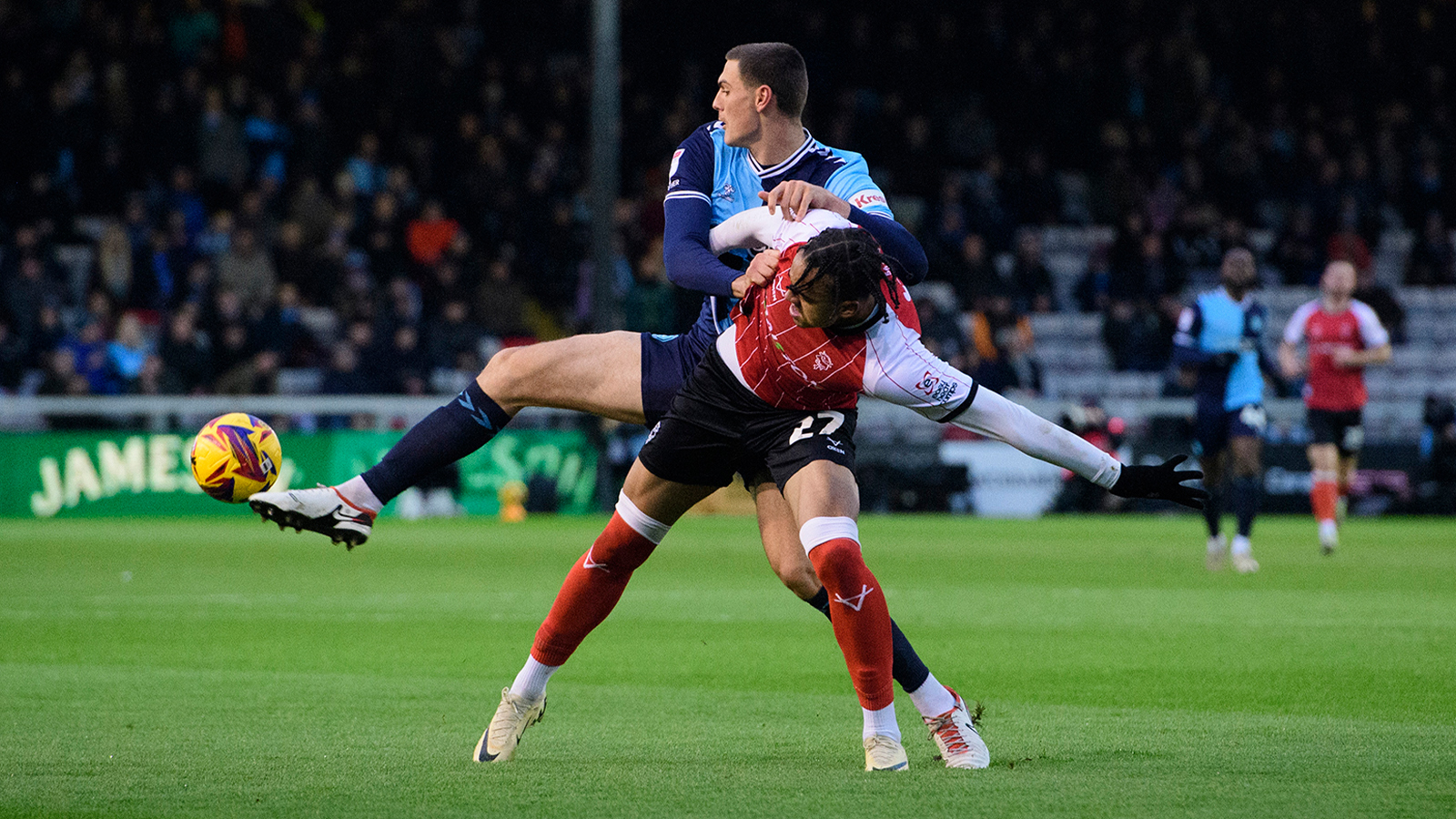 Jovon Makama battles for the ball against Wycombe Wanderers