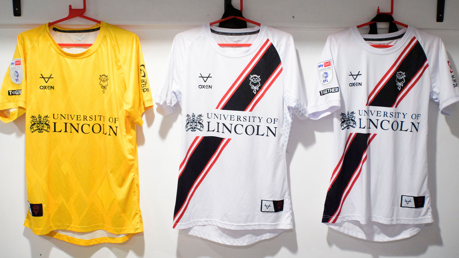 Shirts hung up in the Lincoln City changing room