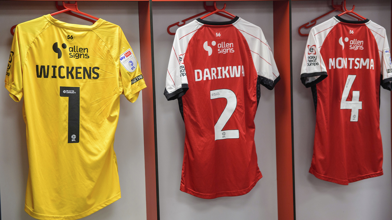 George Wickens, Tendayi Darikwa and Lewis Montsma's shirts are hung up in the home changing roon