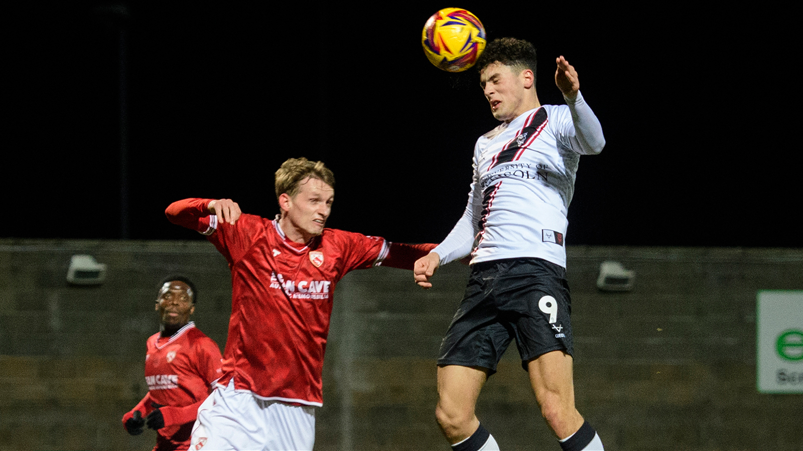 A match action image from the Imps' away Vertu Trophy game at Morecambe