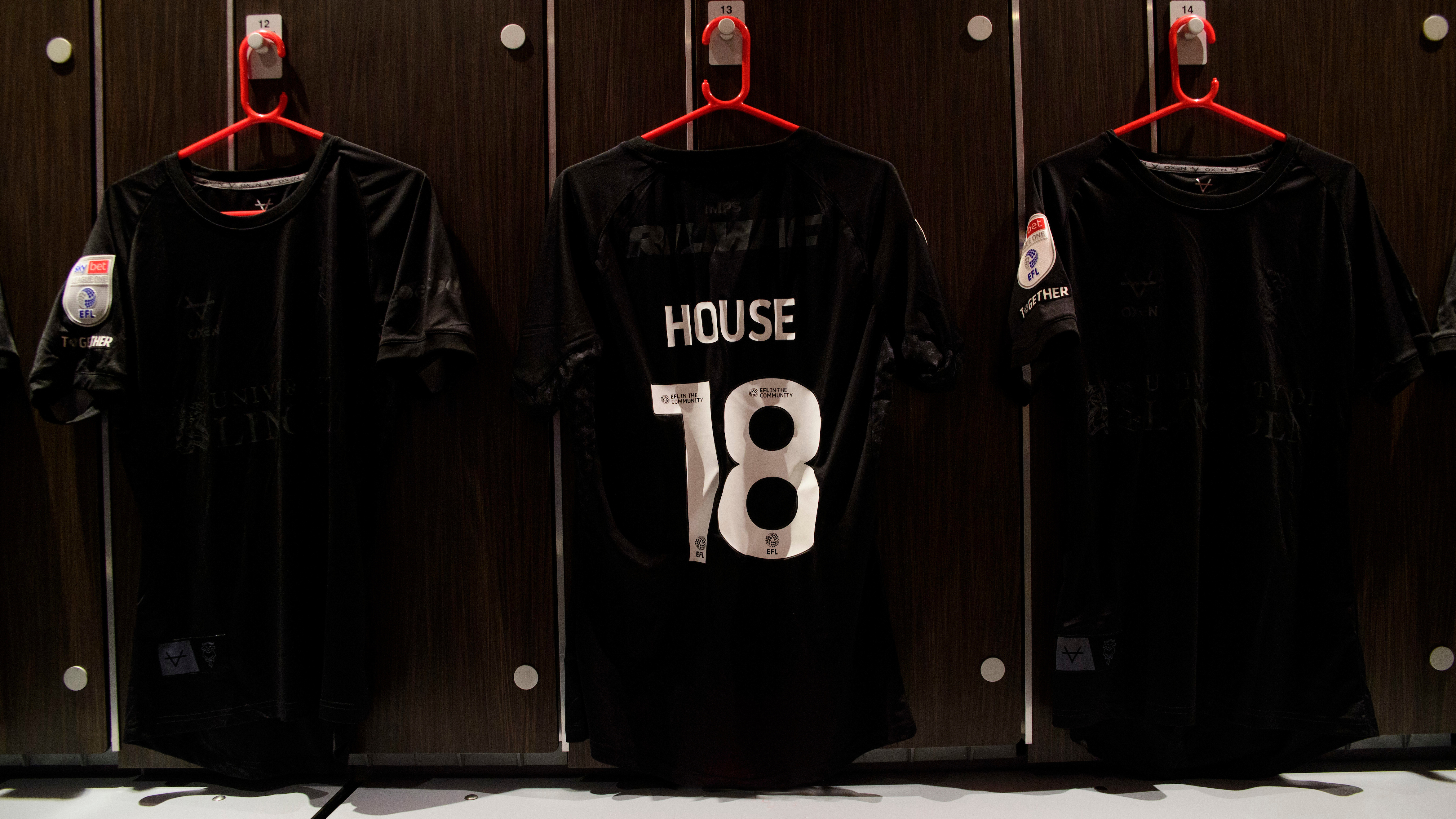 A black shirt with House 18 on the back