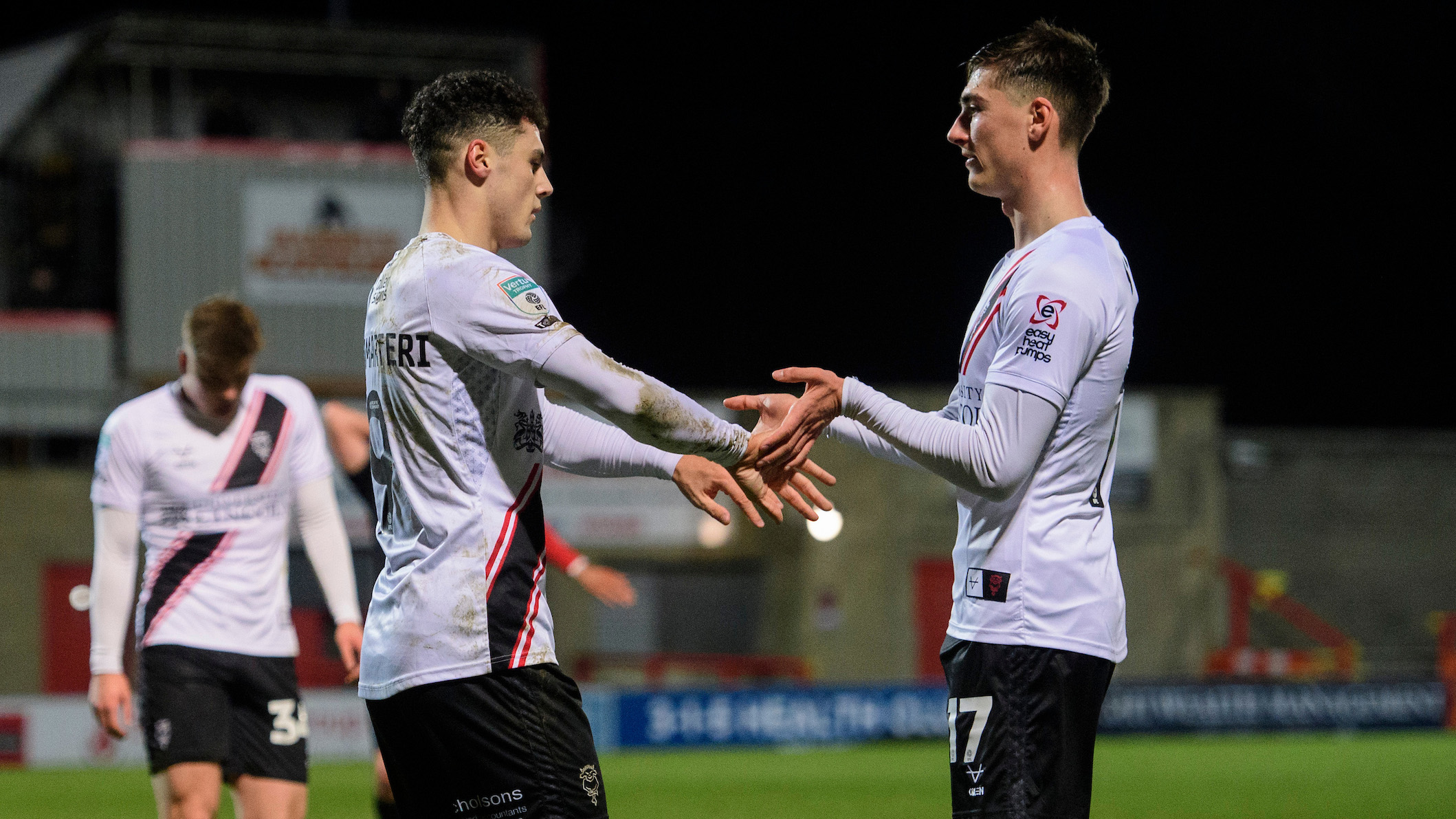 Bailey Cadamarteri and Dylan Duffy celebrate Bailey's goal.