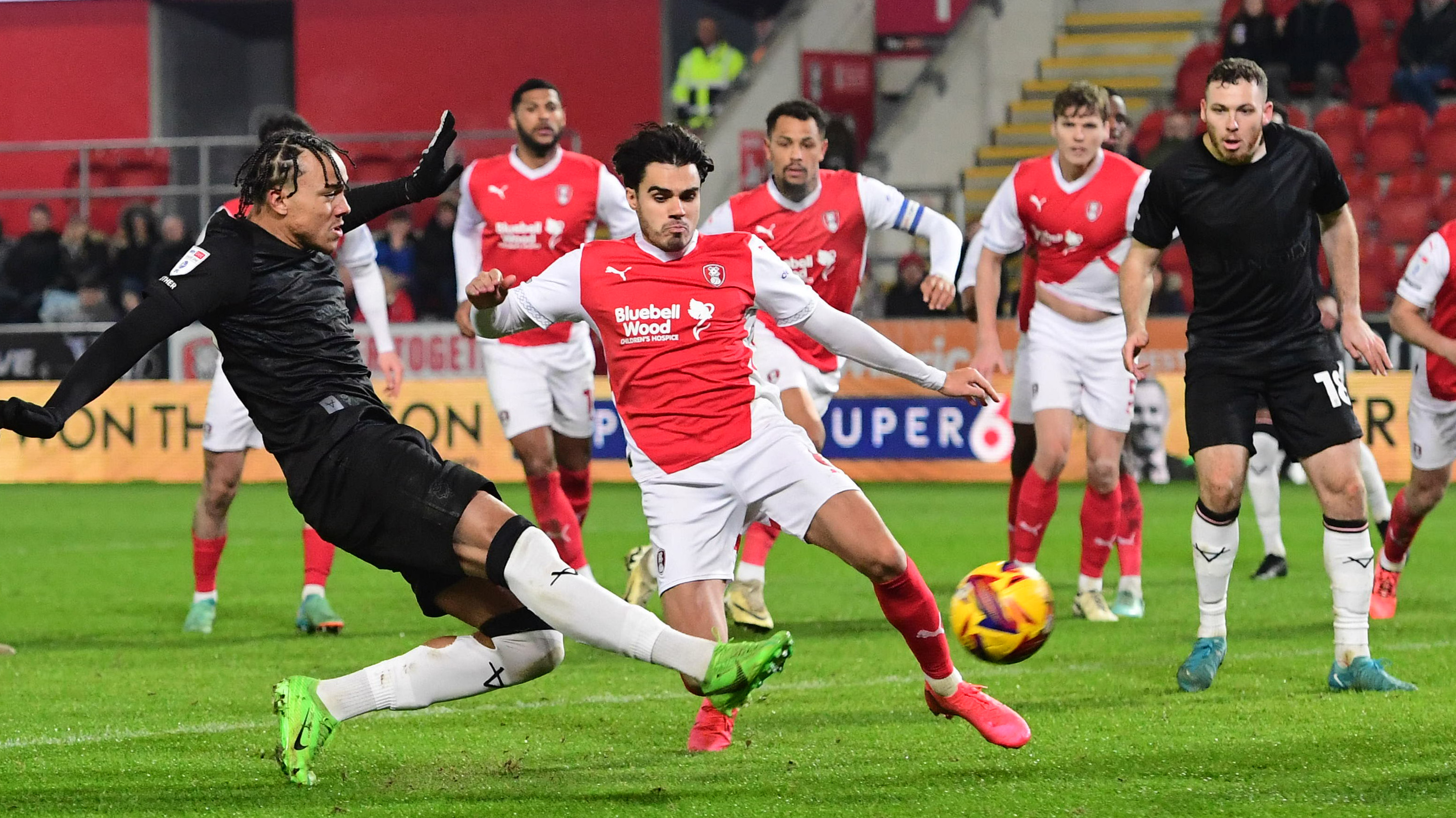 Jovon Makama shoots towards goal to score for Lincoln City