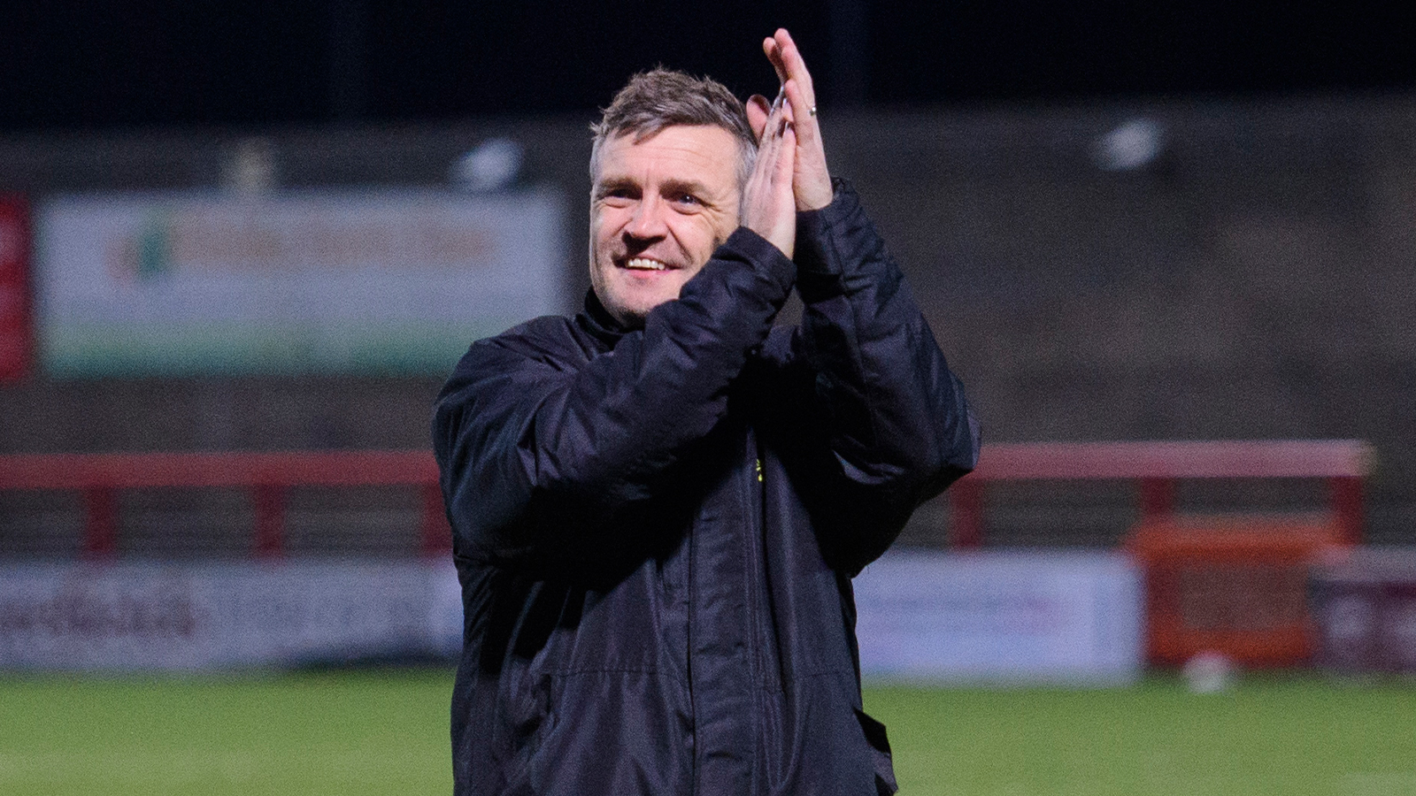 City head coach Michael Skubala applauds the travelling fans after the win at Morecambe