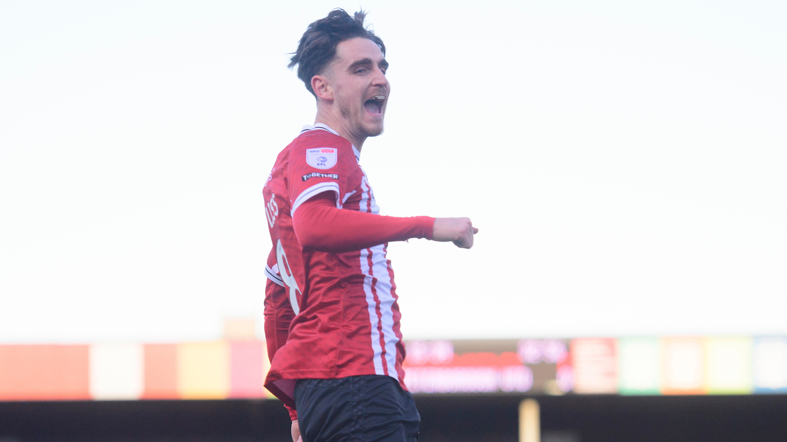 Tom Bayliss celebrates his goal against Peterborough United