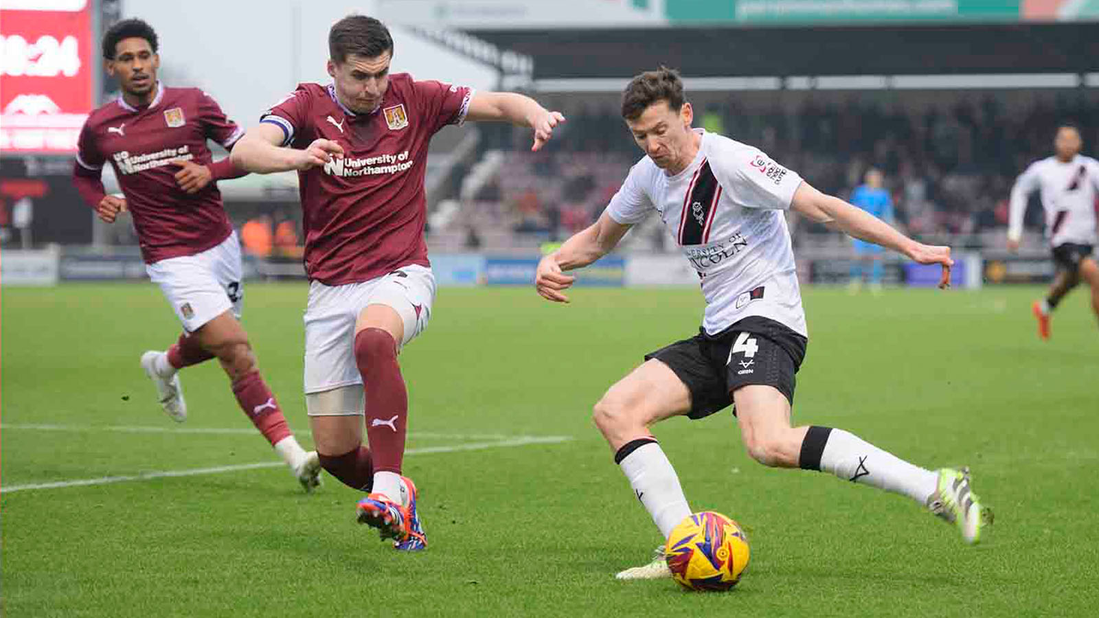 Conor McGrandles on the ball against Northampton Town in October 2024