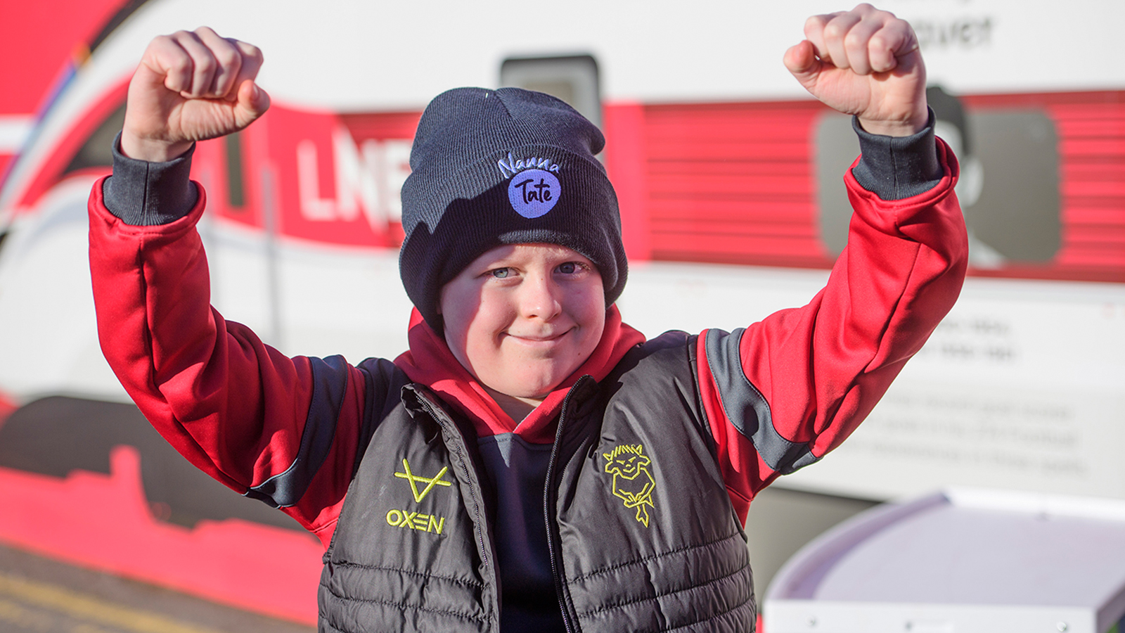 A young supporter outside the LNER Stadium before the game with Peterborough