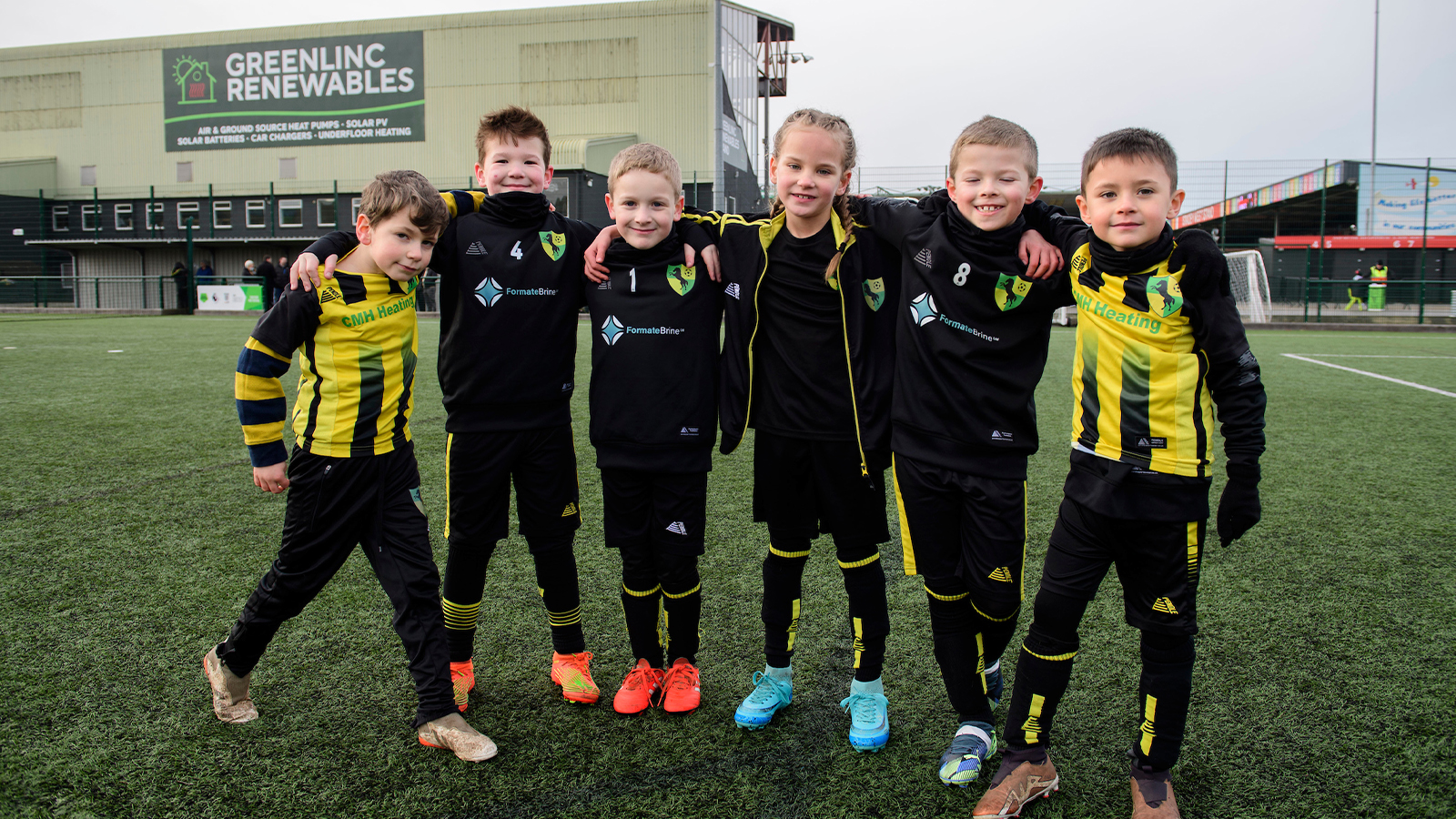 A group of young footballers enjoy the Poacher's matchday experience