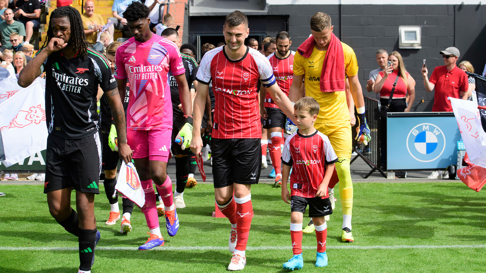 Paudie O'Connor and a mascot lead out the Imps