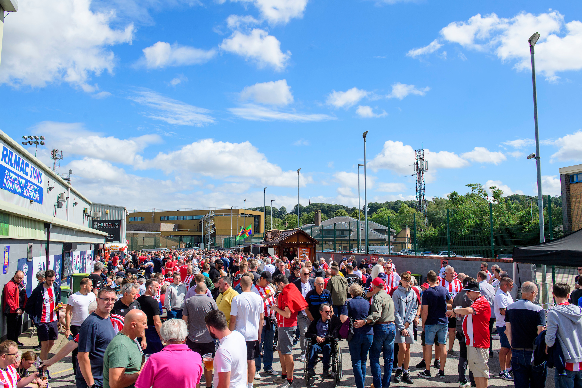 Lincoln City fans enjoy the pre-match atmosphere in the University of Lincoln Fan Village.