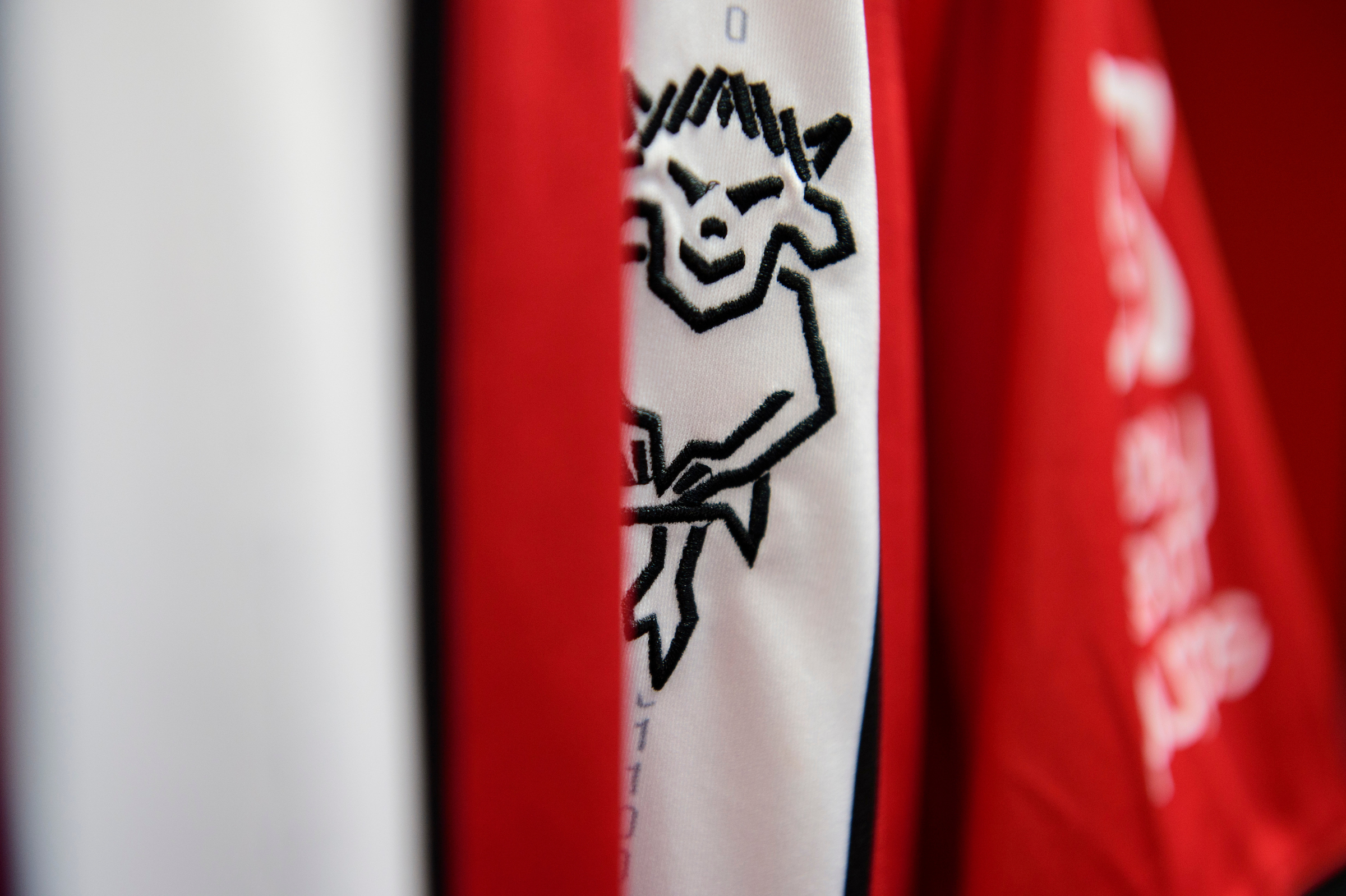 The Lincoln City club badge on a home shirt in the changing room prior to the pre-season friendly match between Lincoln City and West Bromwich Albion at LNER Stadium, Lincoln.