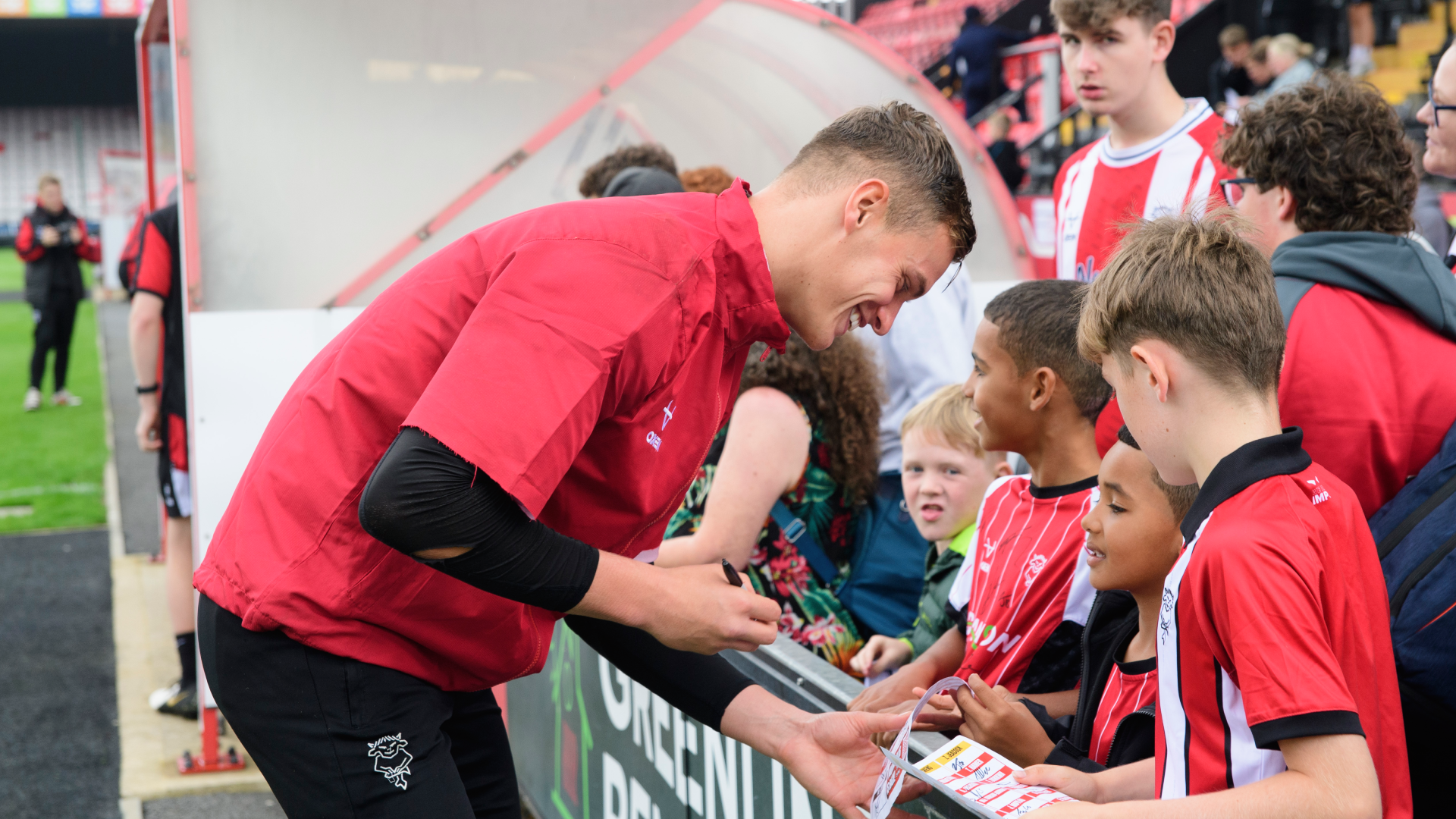 George Wickens signing autographs for supporters at the LNER Stadium.
