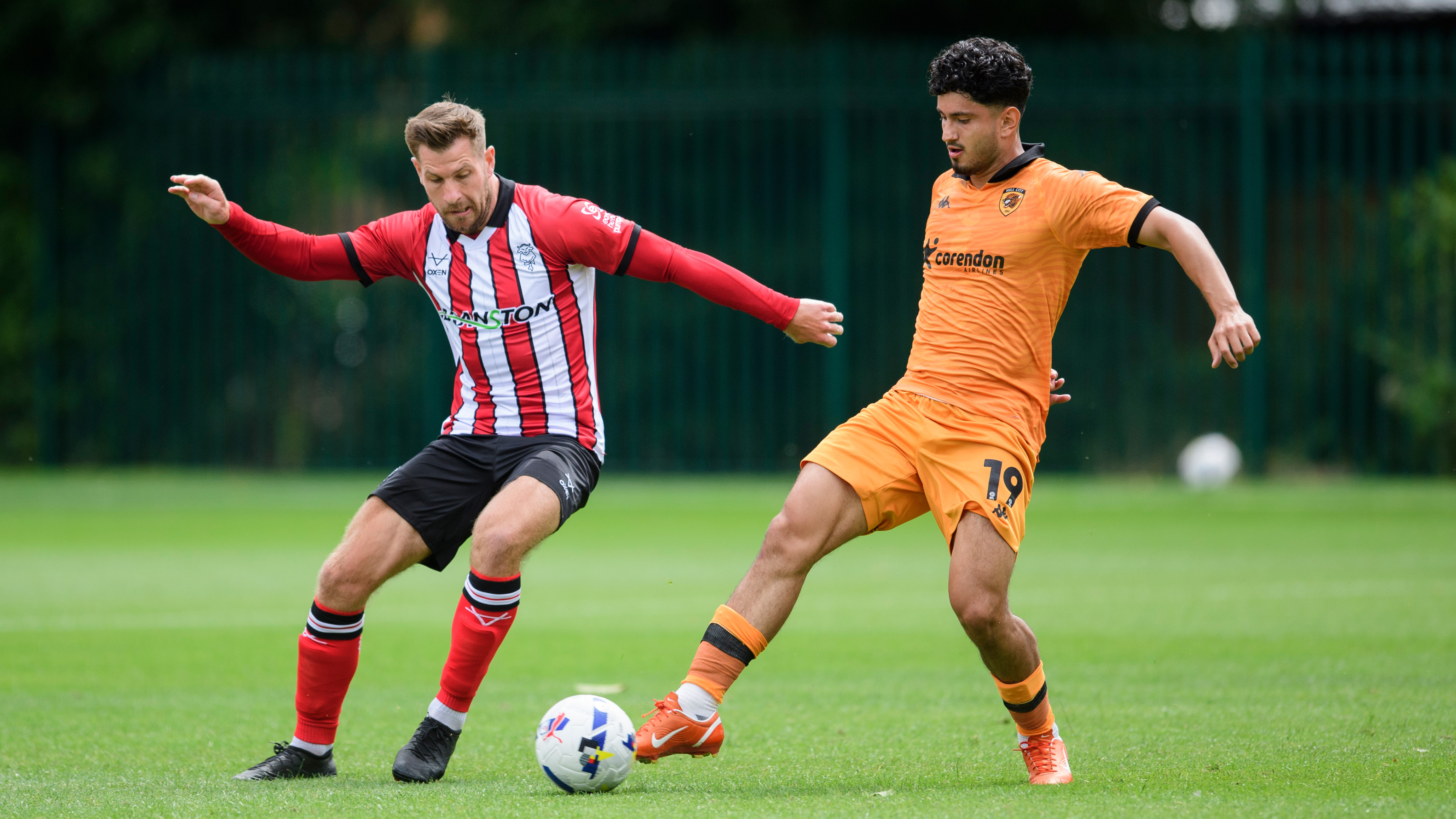 James Collins challenges for the ball