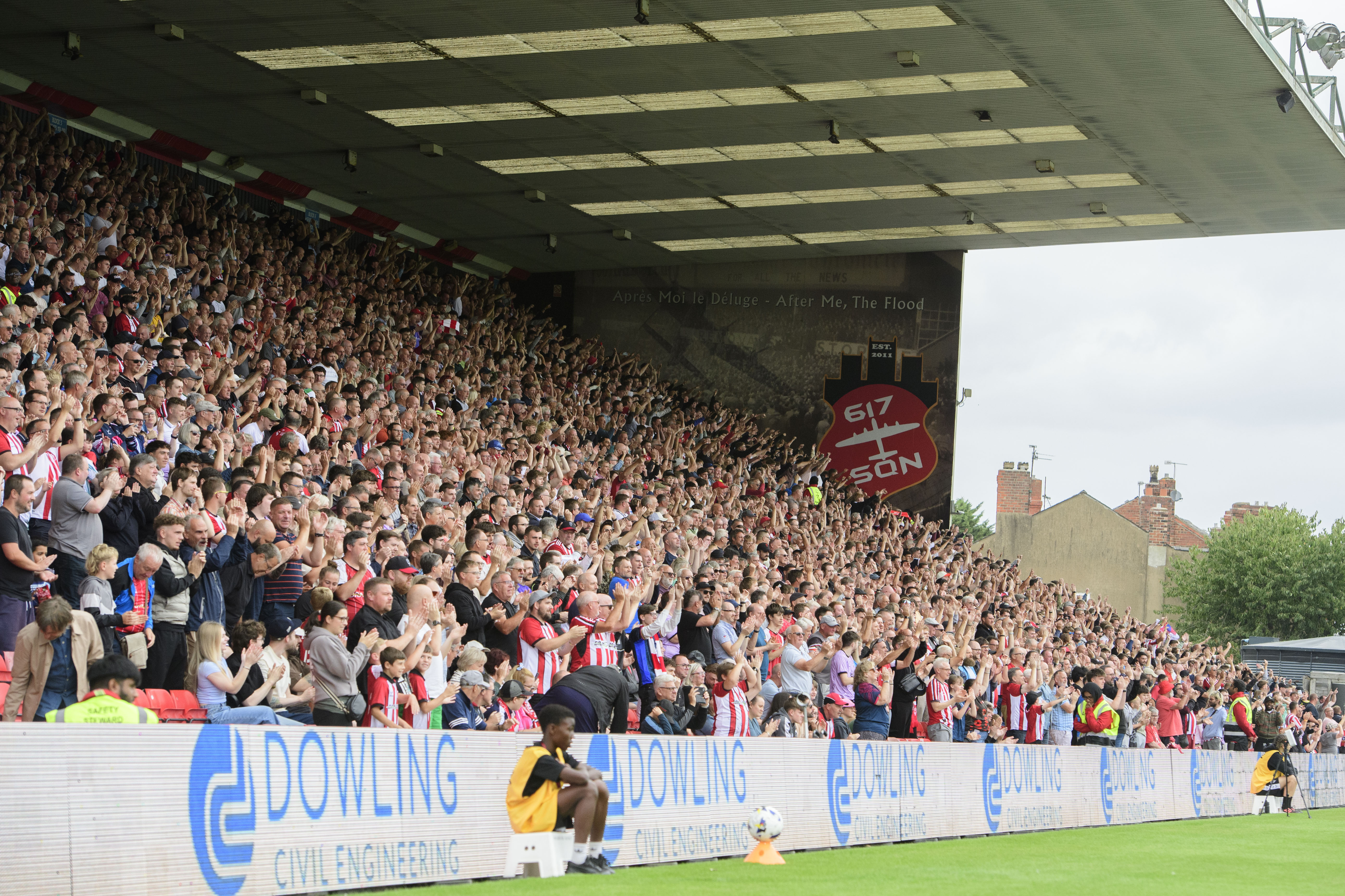 Lincoln City fans celebrate a goal