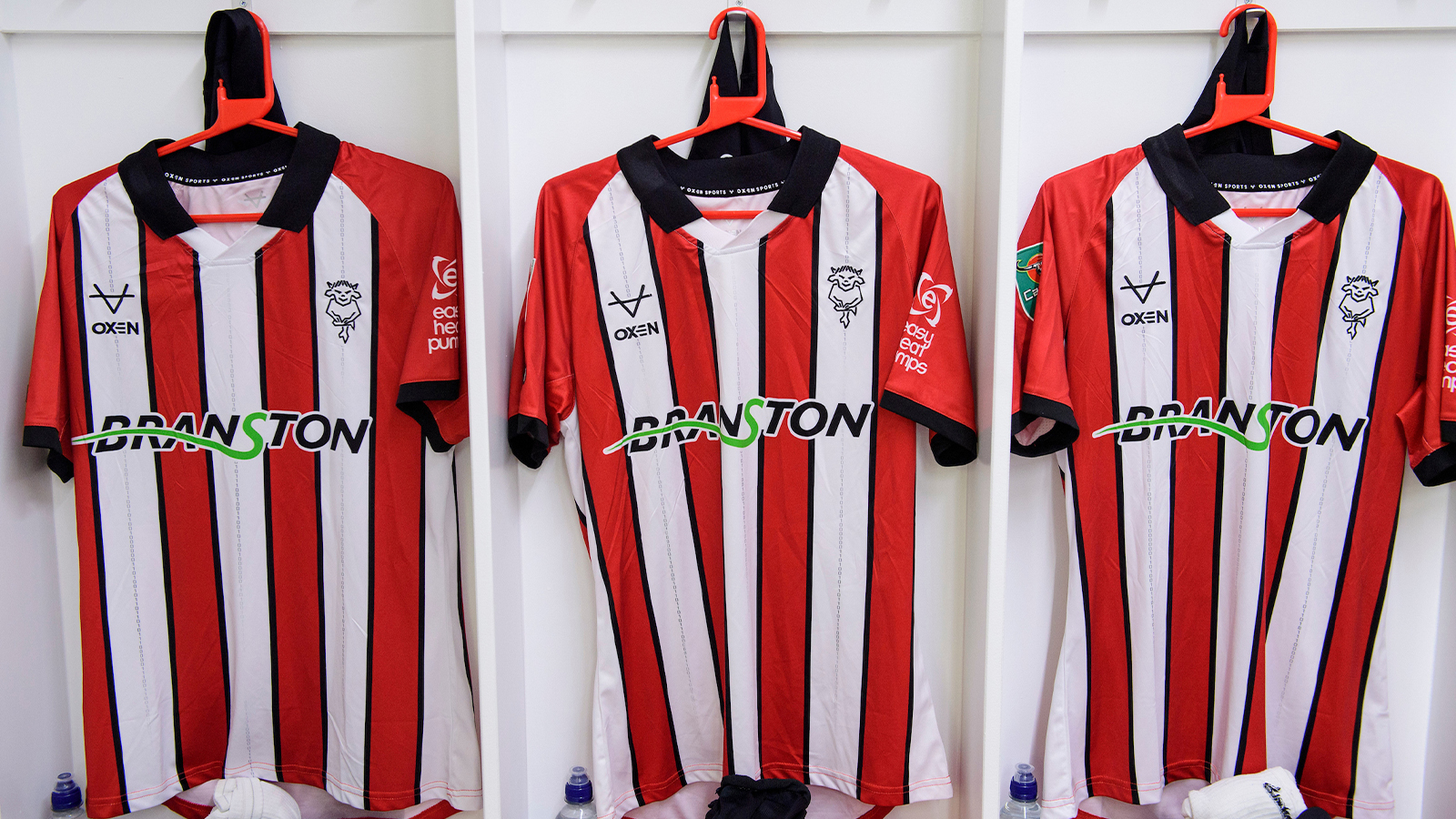 Shirts hung up in the Lincoln City changing room