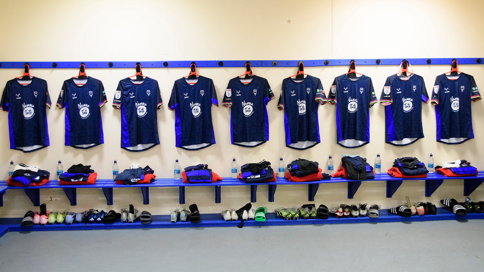 Shirts hung up in the changing room at Bolton Wanderers' stadium