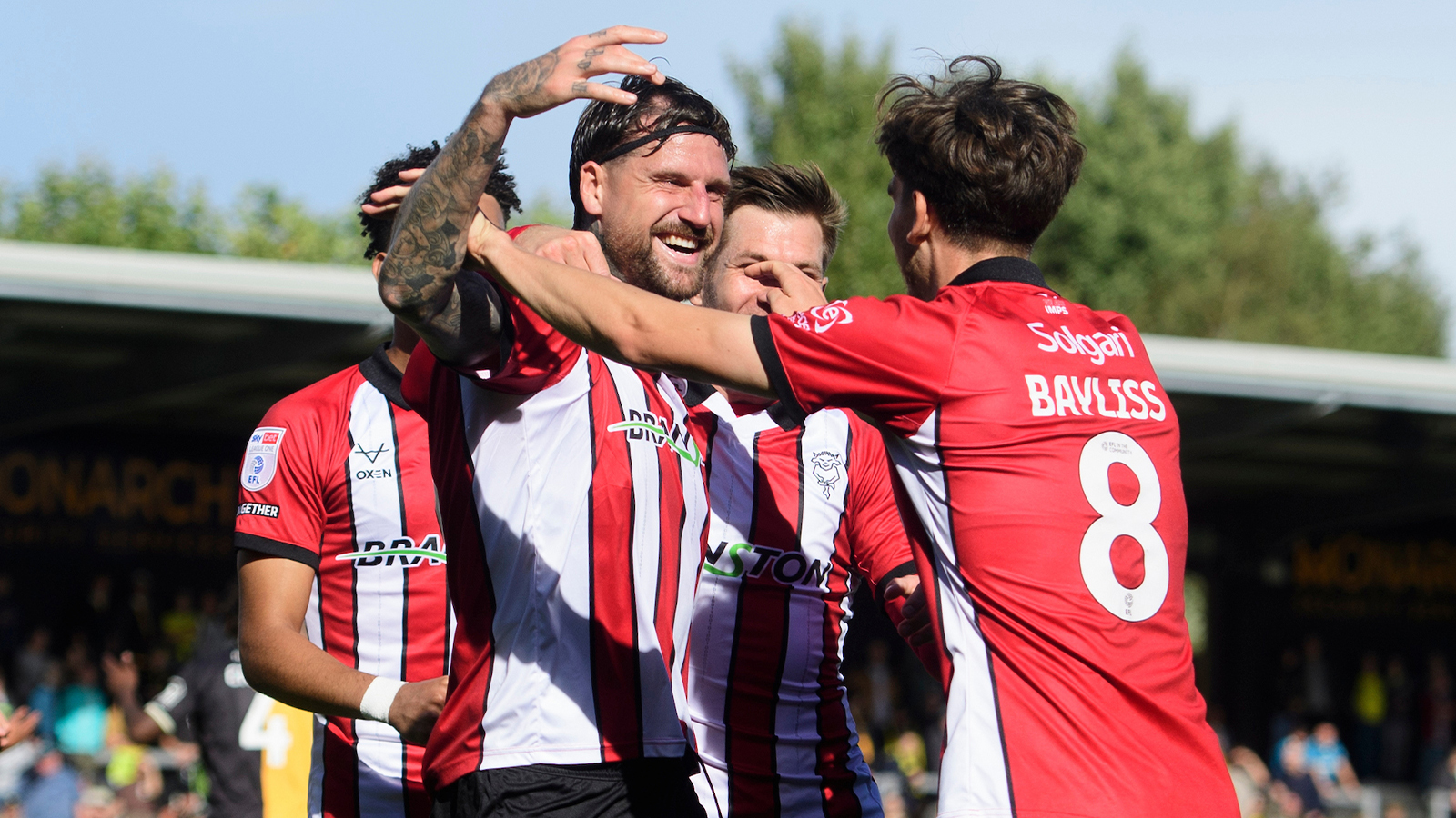 City celebrate Sonny Bradley's goal at Burton Albion