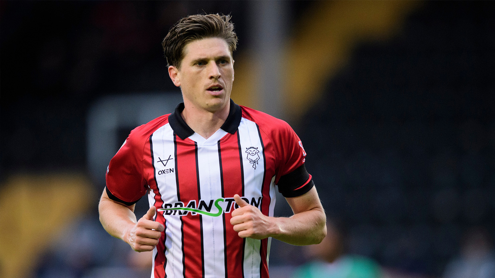 Adam Reach of Lincoln City during the Vertu Trophy Northern Section group D match between Lincoln City and Notts County at LNER Stadium, Lincoln.