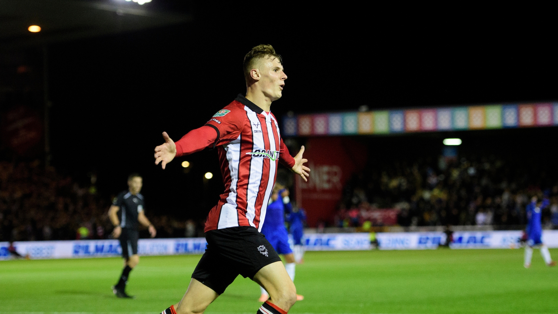 Rob Street of Lincoln City celebrates scoring the opening goal during the Carabao Cup third round match between Lincoln City and Chelsea at LNER Stadium, Lincolnshire.