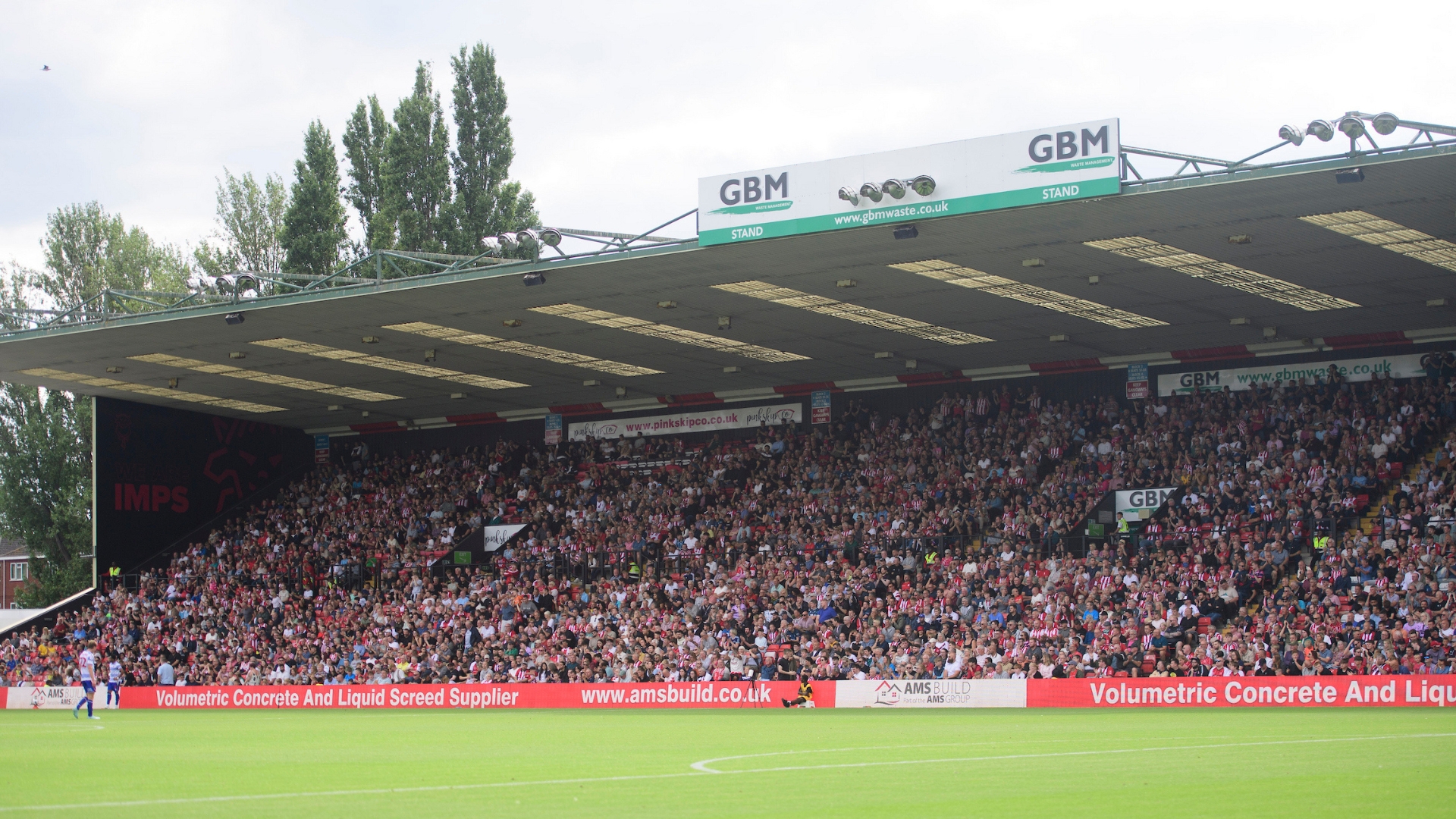 Lincoln City fans watch their team in action during the EFL Sky Bet League One match between Lincoln City and Reading at LNER Stadium, Lincoln.
