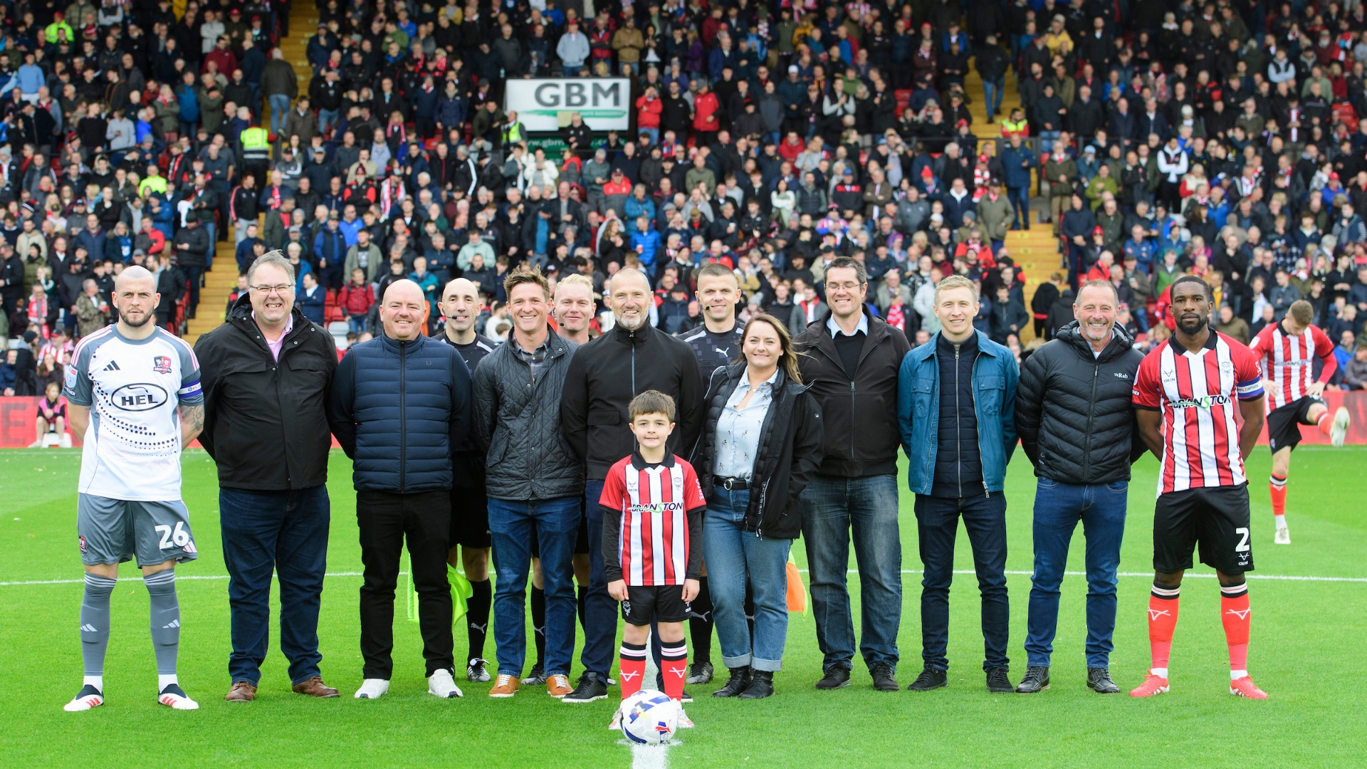 Centre circle group prior to the EFL Sky Bet League One match between Lincoln City and Exeter City at LNER Stadium, Lincoln.
