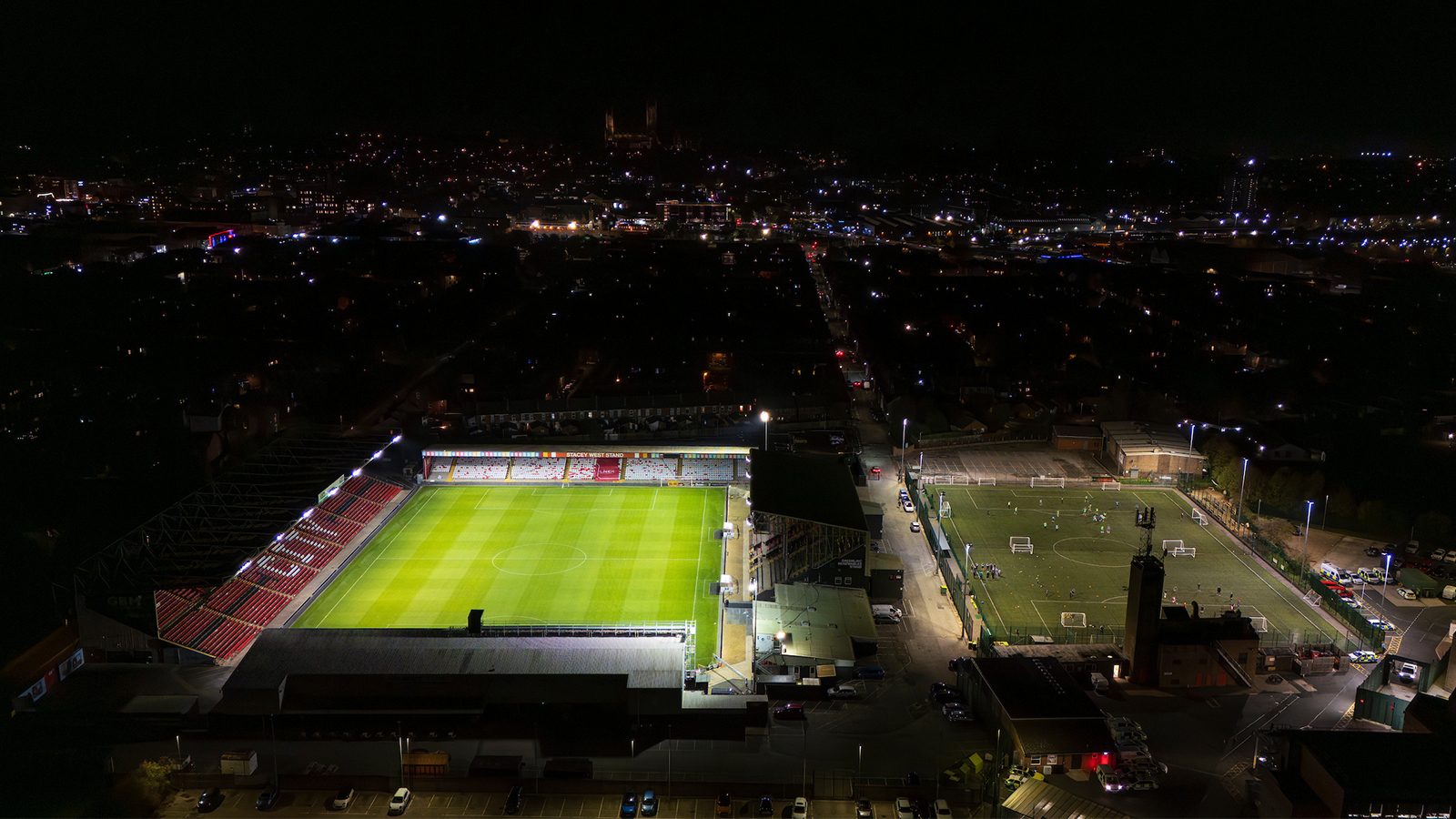 An aerial view of the LNER Stadium and adjacent 3G pitch at night time