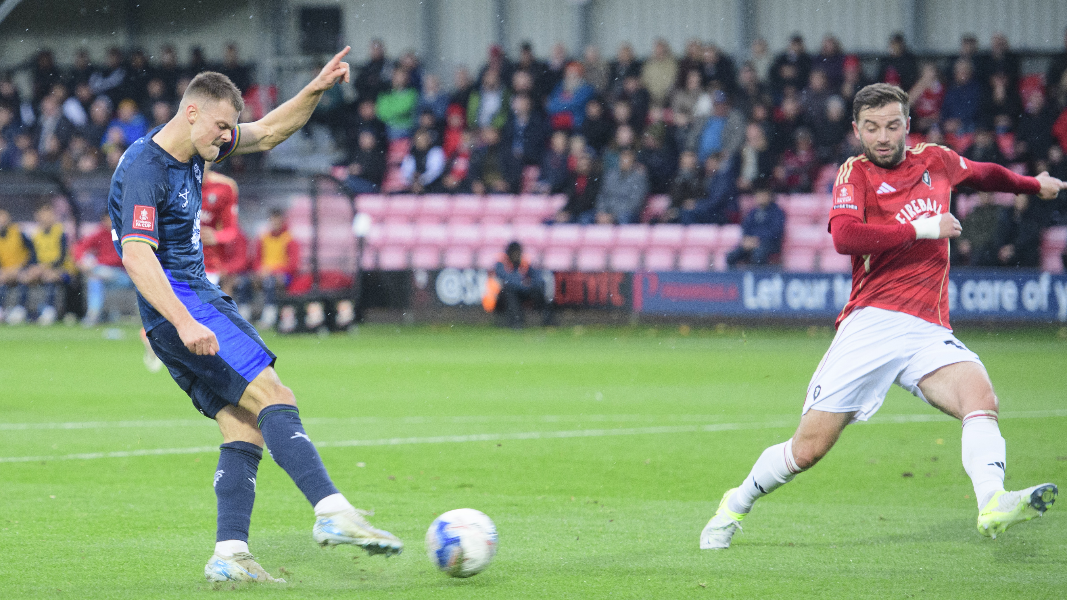 Erik Ring, in blue, takes a shot