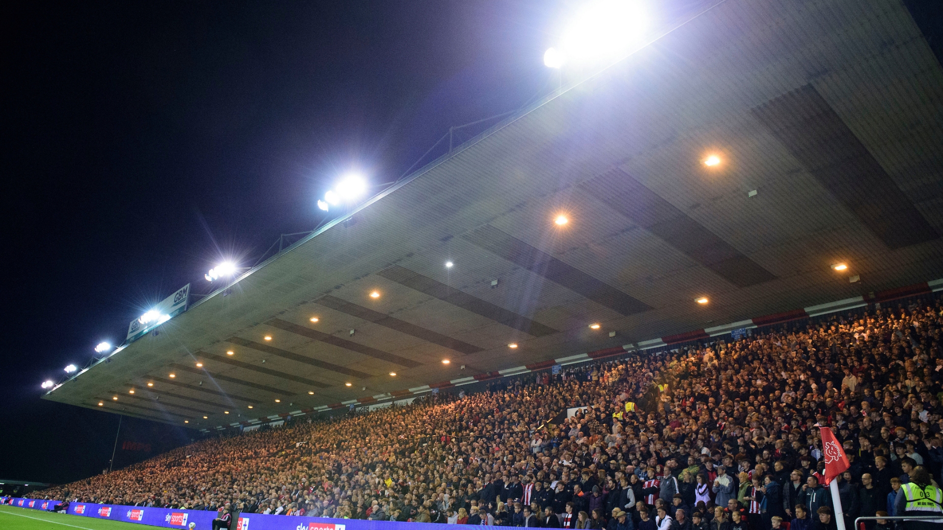 Lincoln City fans watch their team in action during the Carabao Cup third round match between Lincoln City and Chelsea at LNER Stadium, Lincolnshire.