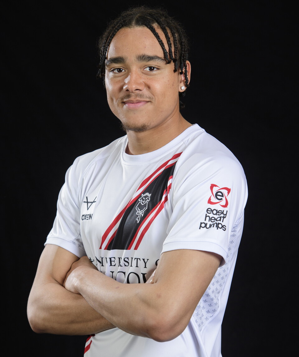 Jovon Makama pictured in the 24/25 away kit. It is white and you can see the Easy Heat Pumps sleeve on the left arm